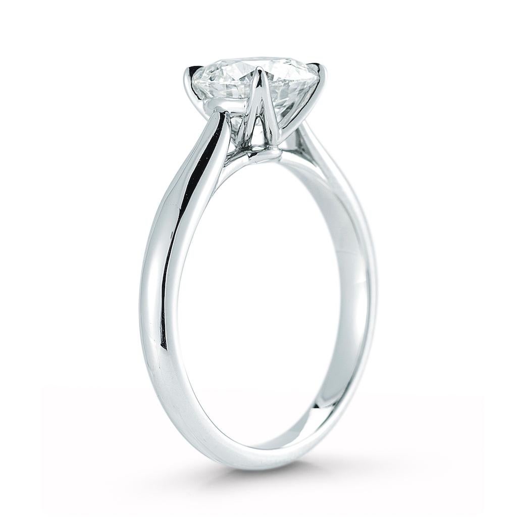 This diamond ring features solitaire round brilliant cut diamond on a tapered band. 

The center stone is available in all sizes, colors and qualities. Setting available in platinum, gold, white gold, and rose gold. 

This ring is made in Platinum