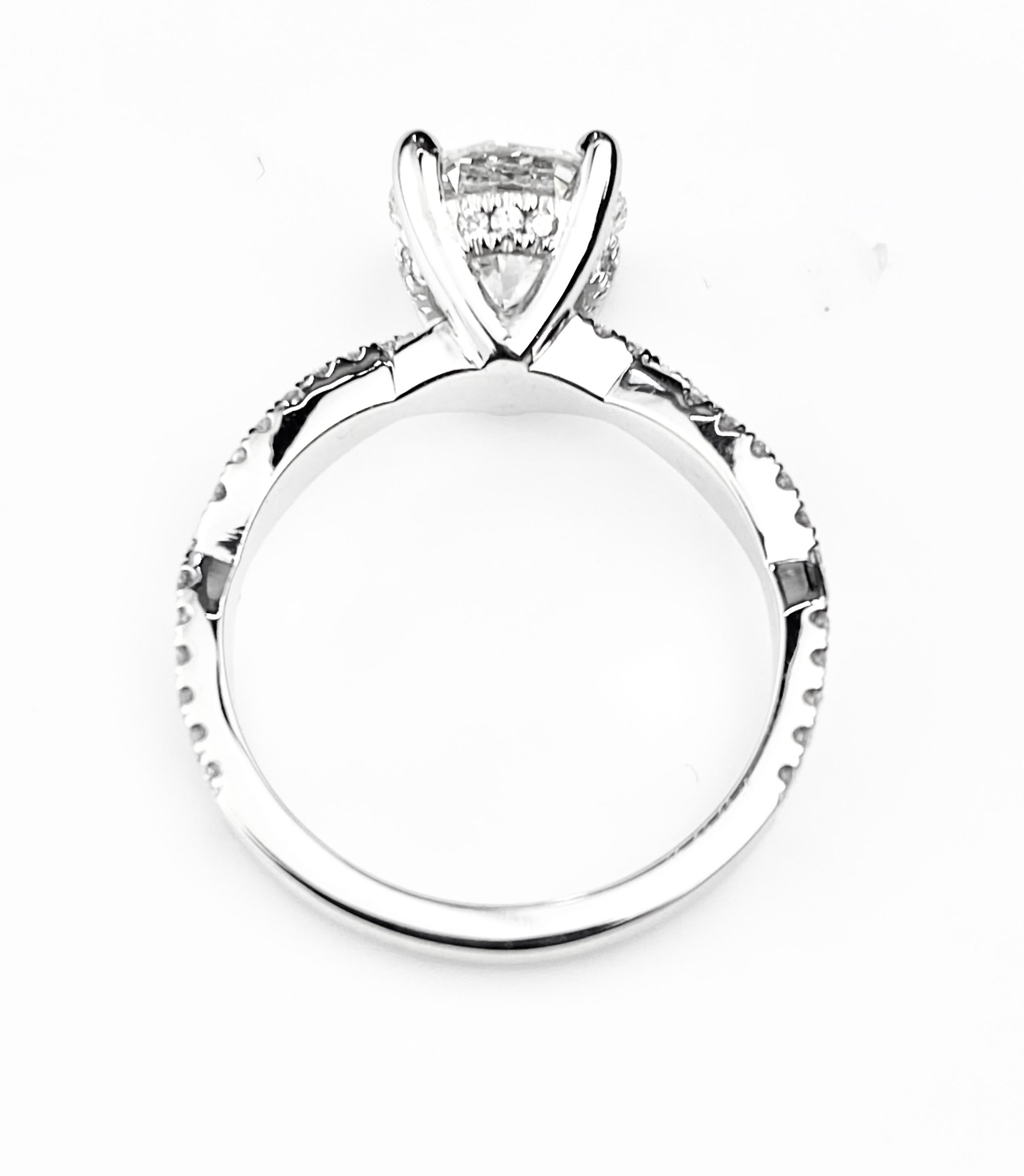 Contemporary Round Cut Solitaire Diamond Engagement Ring with Twist Design Setting For Sale