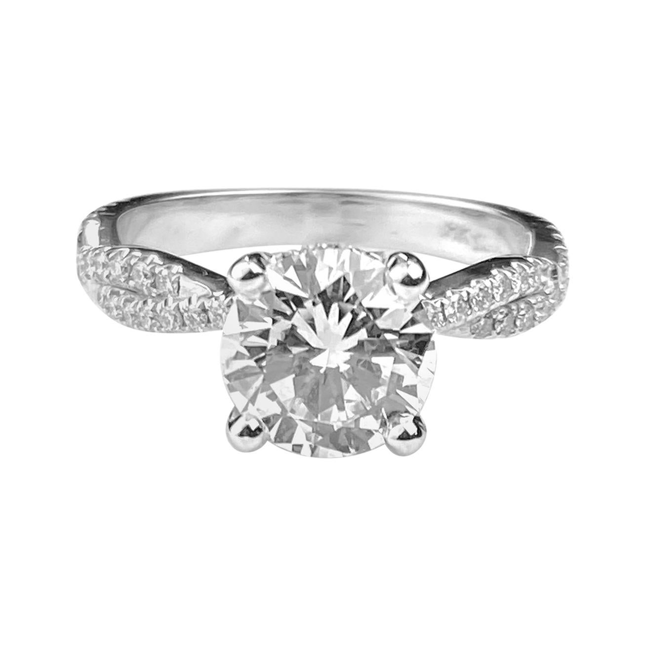 Round Cut Solitaire Diamond Engagement Ring with Twist Design Setting For Sale