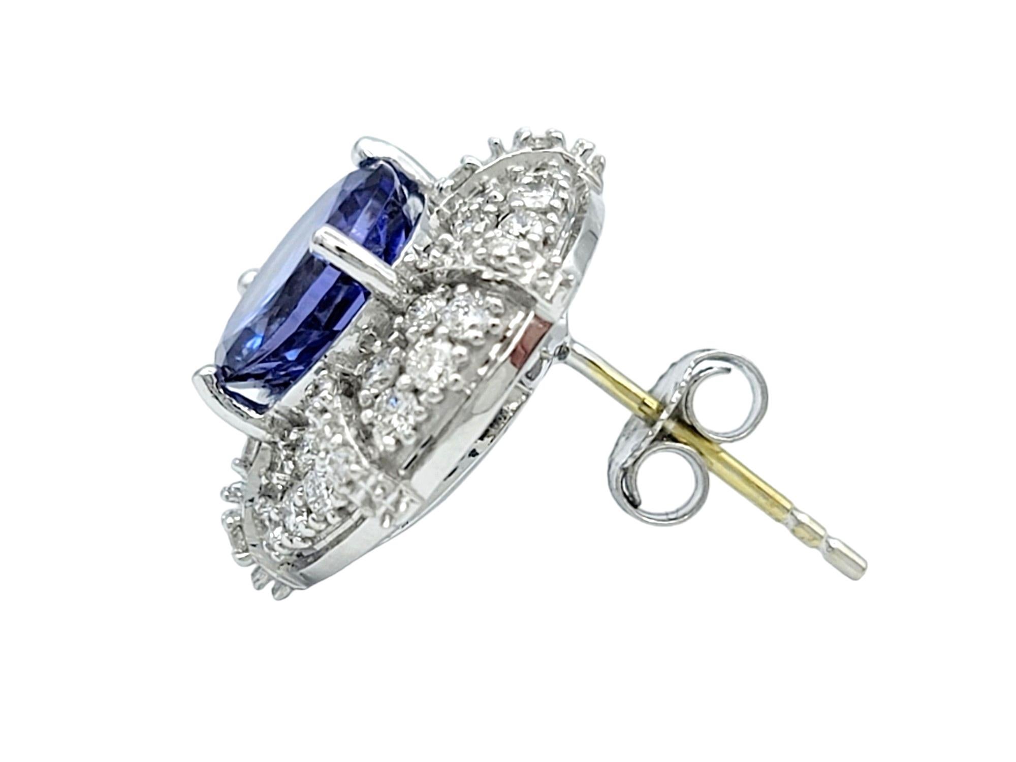 Contemporary Round Cut Tanzanite and Double Diamond Halo Stud Earrings in 18 Karat White Gold For Sale