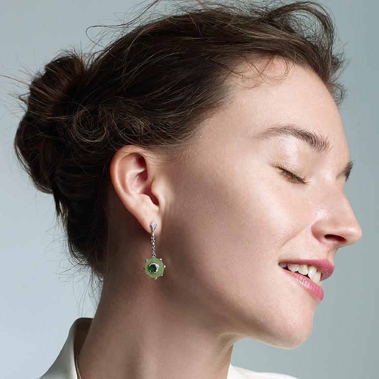 
About the collection 
Inspired by medieval Gothic structures, the ROMAnce collection offers striking, yet delicate silhouettes. 

Product details 
Striking oval tsavorites surrounded by Afghan jade and brilliant-cut diamonds drop delicately from