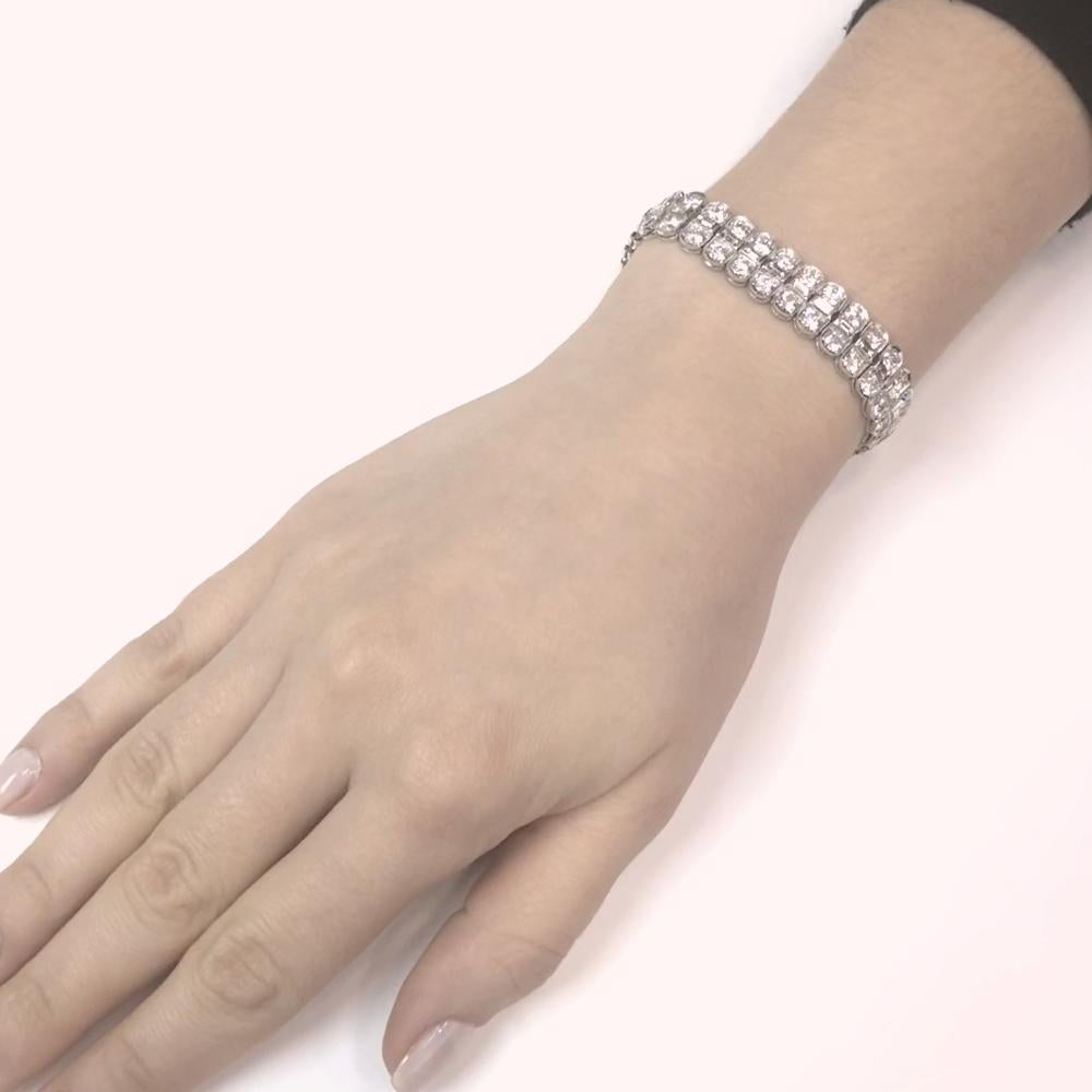 A beautiful diamond platinum link tennis bracelet.
Adorned in pairs of stunning round cut white natural diamonds with a center spine of rectangle cut diamonds.  The diamonds are all together 18.09 ct total.
Diamonds get that extra sparkle against