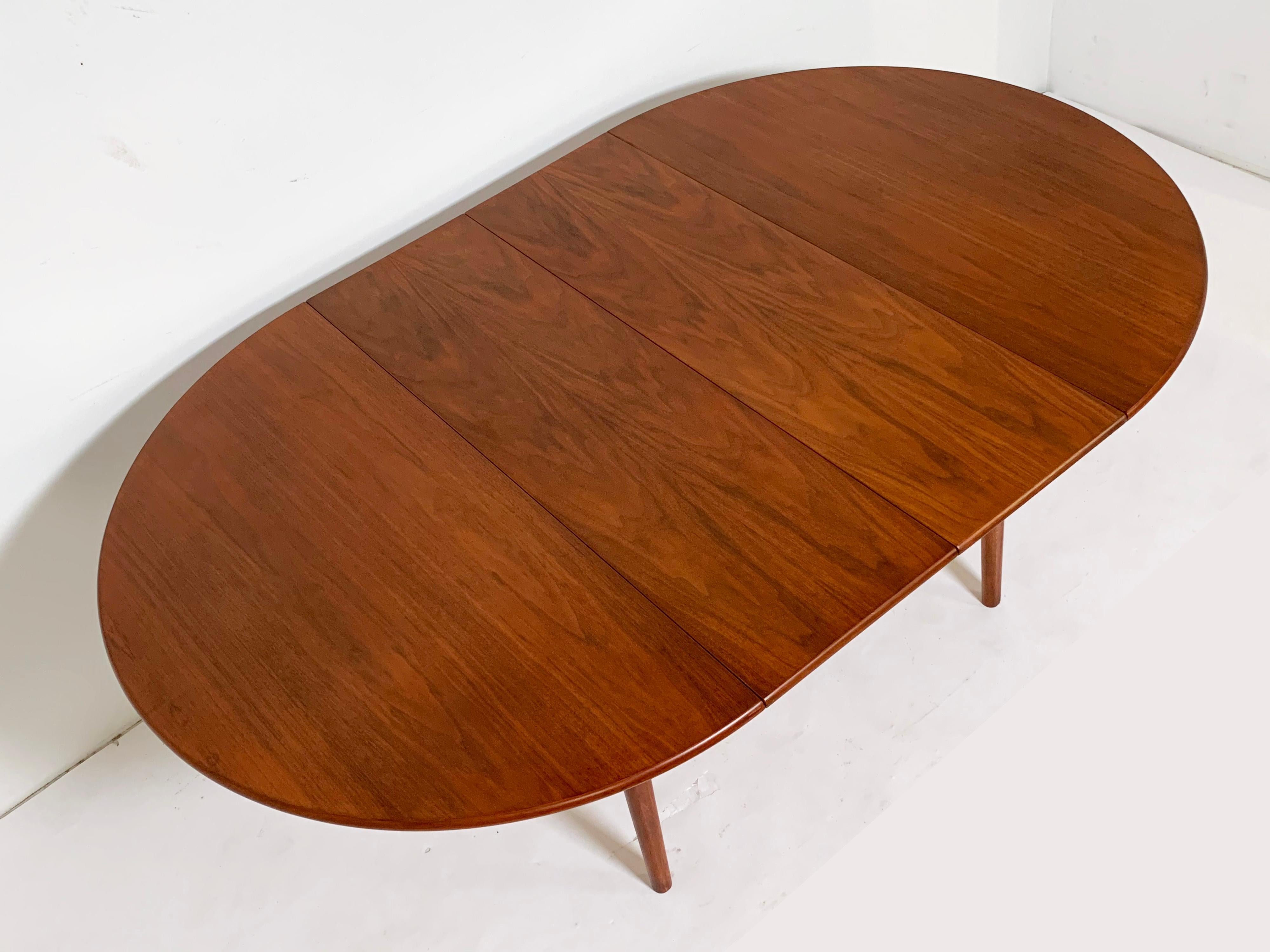European Round Danish Teak Dining Table with Two Leaves, circa 1960s