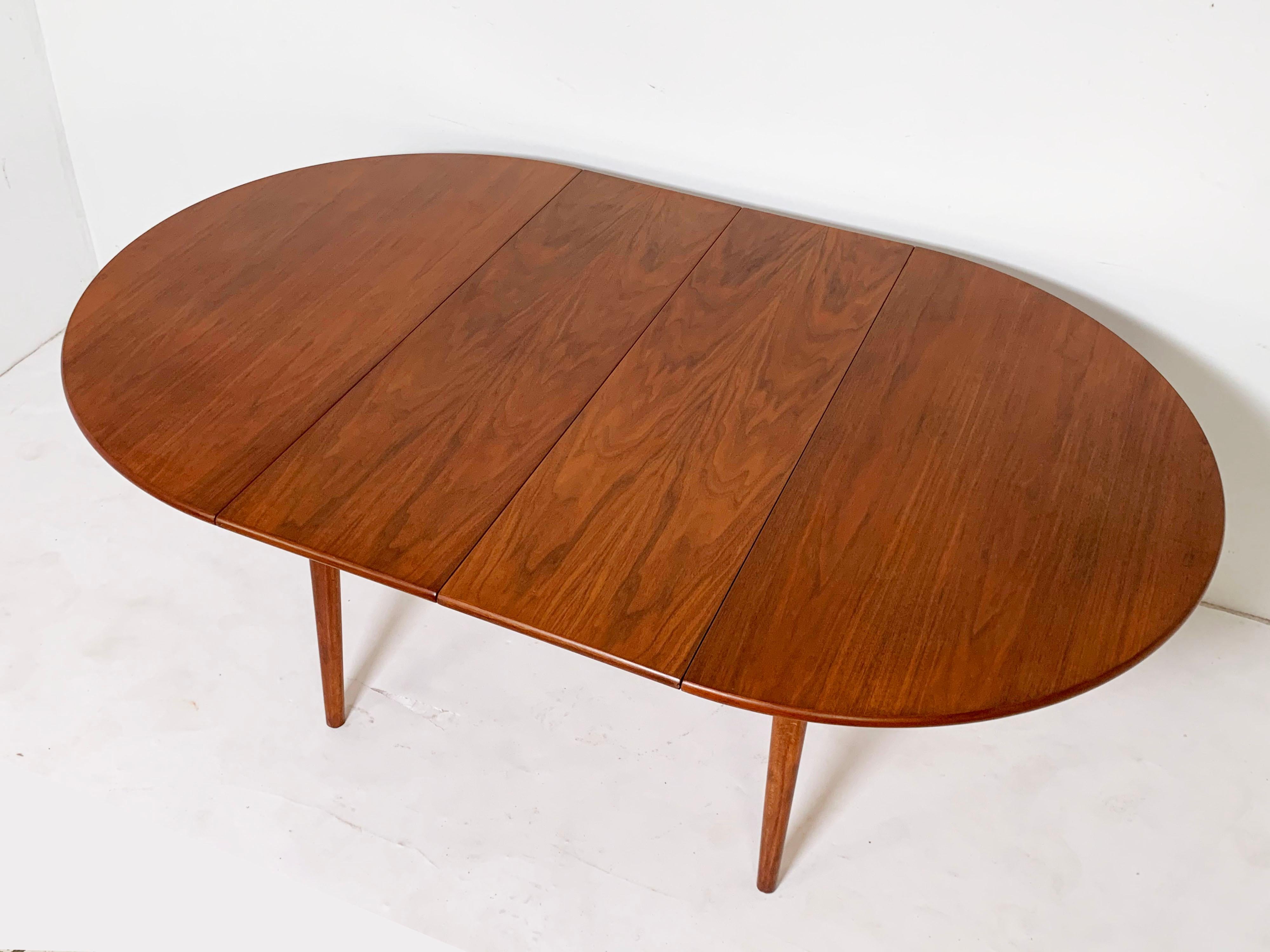 Round Danish Teak Dining Table with Two Leaves, circa 1960s In Good Condition In Peabody, MA