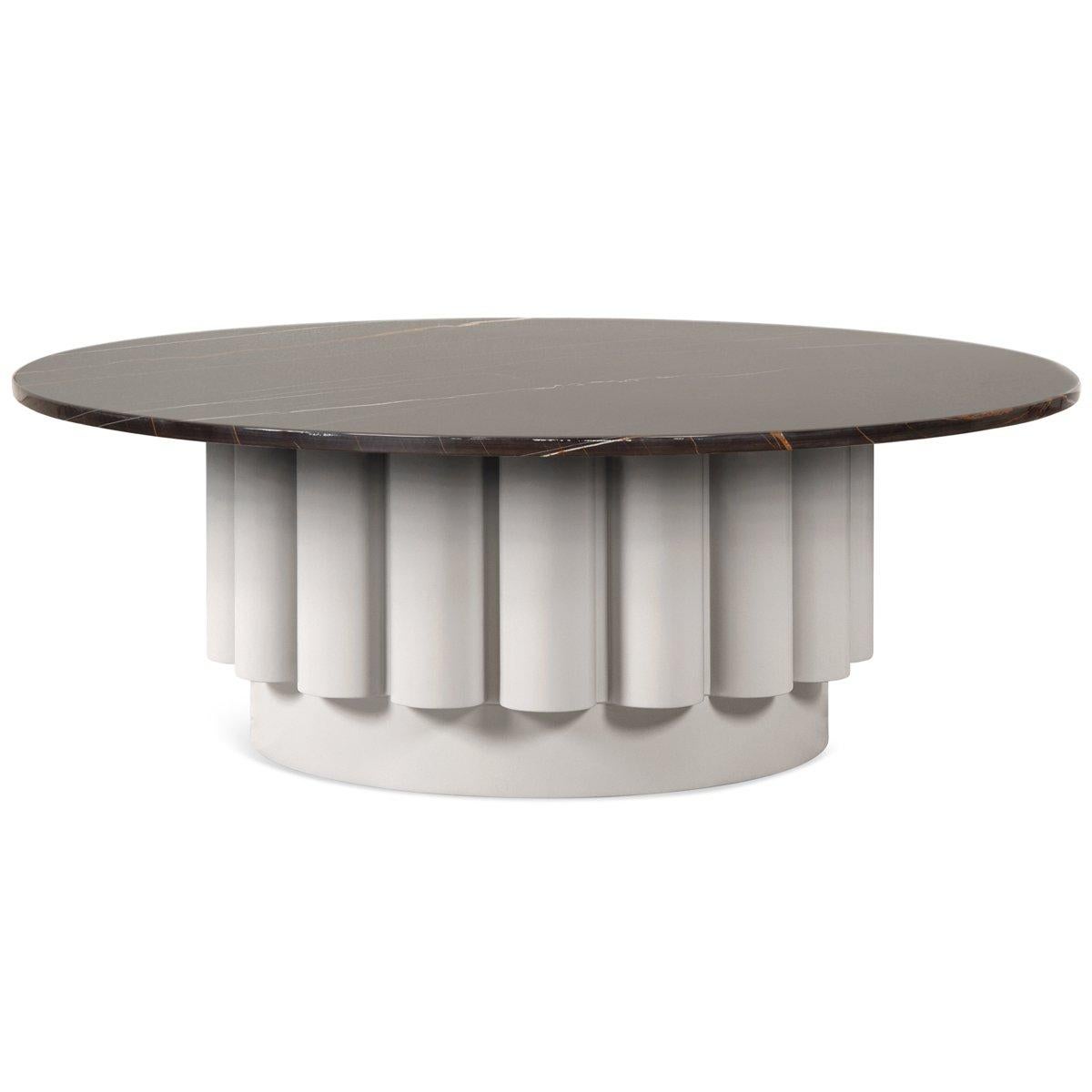 For those wanting a stunning center-piece for a living room or lobby. A fluted base in smoke ember lacquer finish is the most distinctive design element of this customizable coffee table. The posh Dark River stone marble top is dramatic and