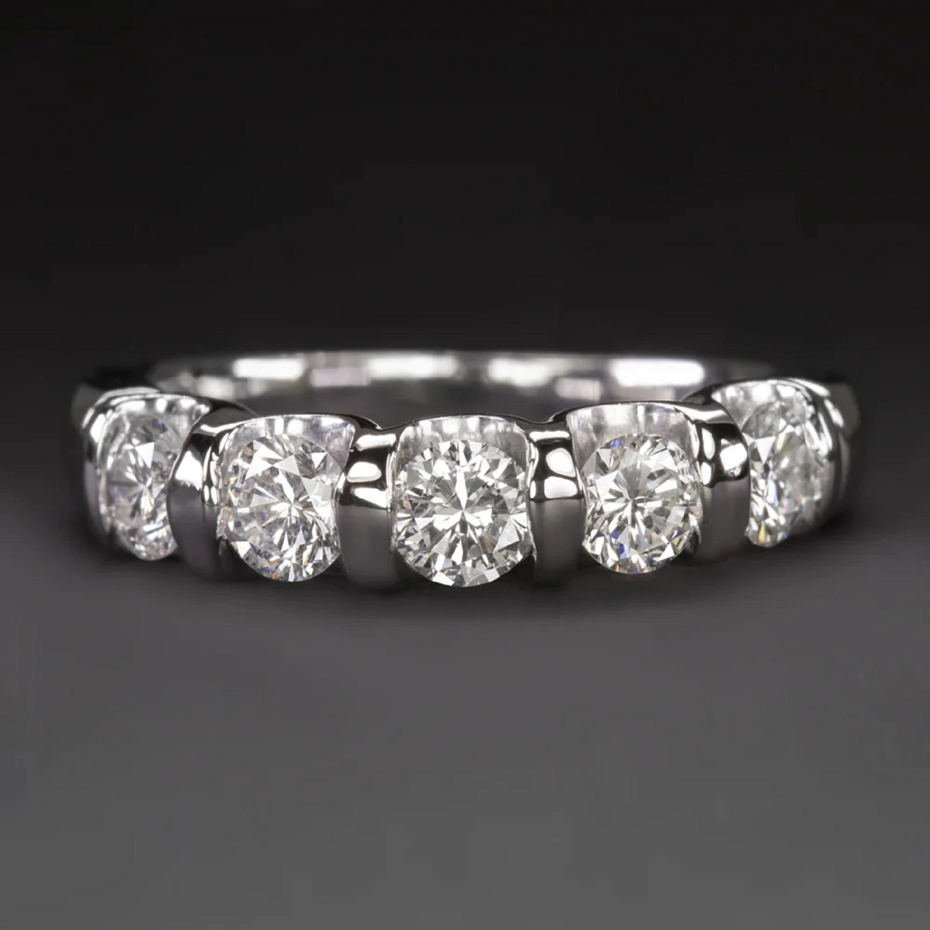  1 carat of bright white and eye clean diamonds

- Diamonds are excellent cut for fantastic sparkle!

- Substantial 14k white gold setting

- Classic 5 stone design

Dimensions:

The ring measures 4.1mm across (north south) and 4.2mm from finger to