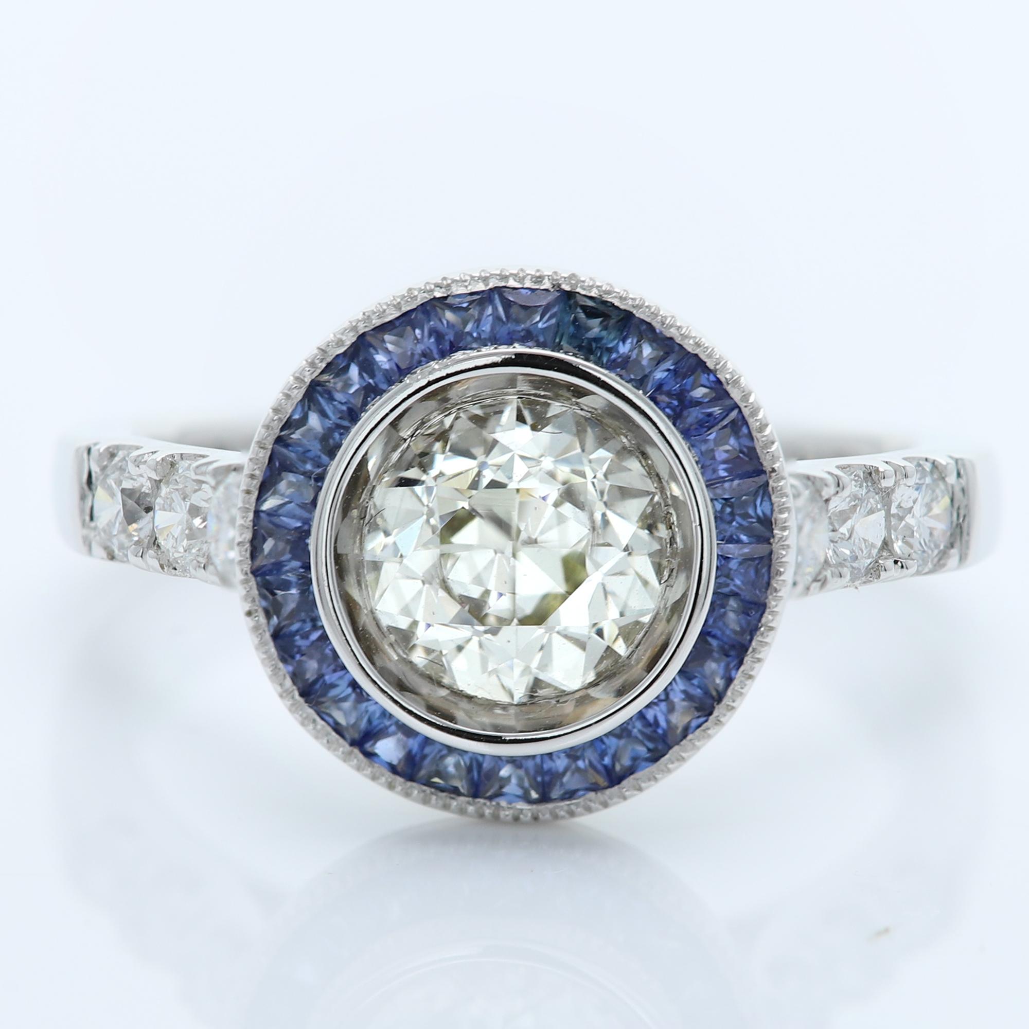 Art Deco Style Bold Ring
Center is 1.25 carat Diamond surrounded with Blue Sapphire, sides have regular small white Diamonds
All stones are Natural
18k White 5.70 grams
Center Diamond is a Brilliant J-K color and SI2-I1 clean however has a very good