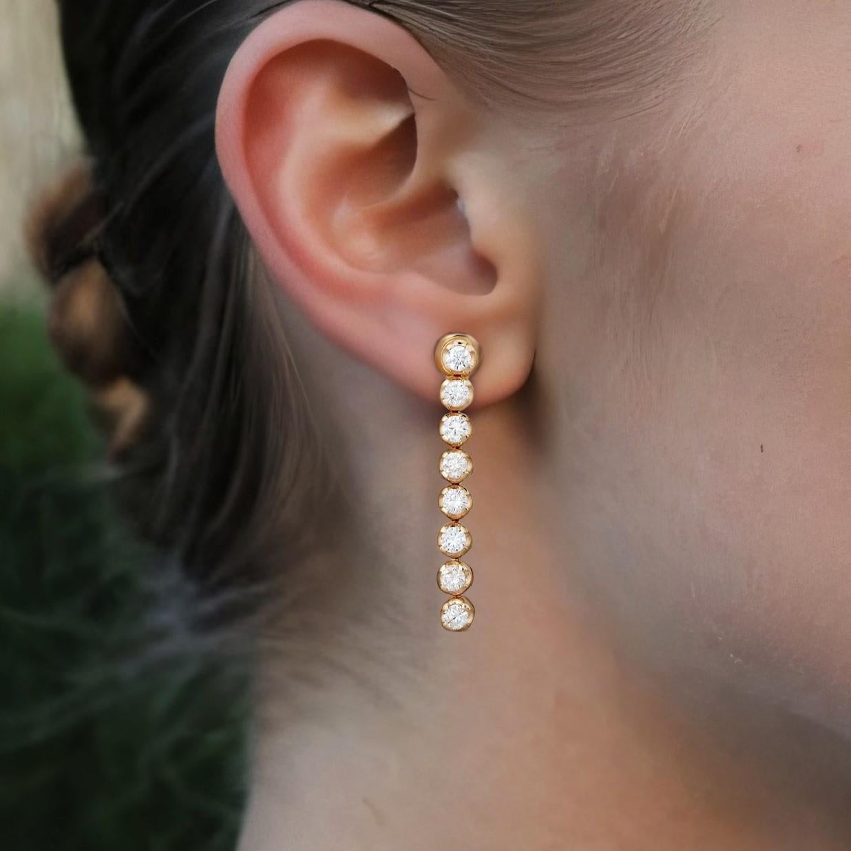 Radiate timeless sophistication with the Round Diamond 14K Yellow Gold Linear Drop Earrings, crafted in 14K Yellow and White Gold. Featuring 0.91CT of dazzling natural diamonds, these earrings are a perfect blend of elegance and brilliance, making