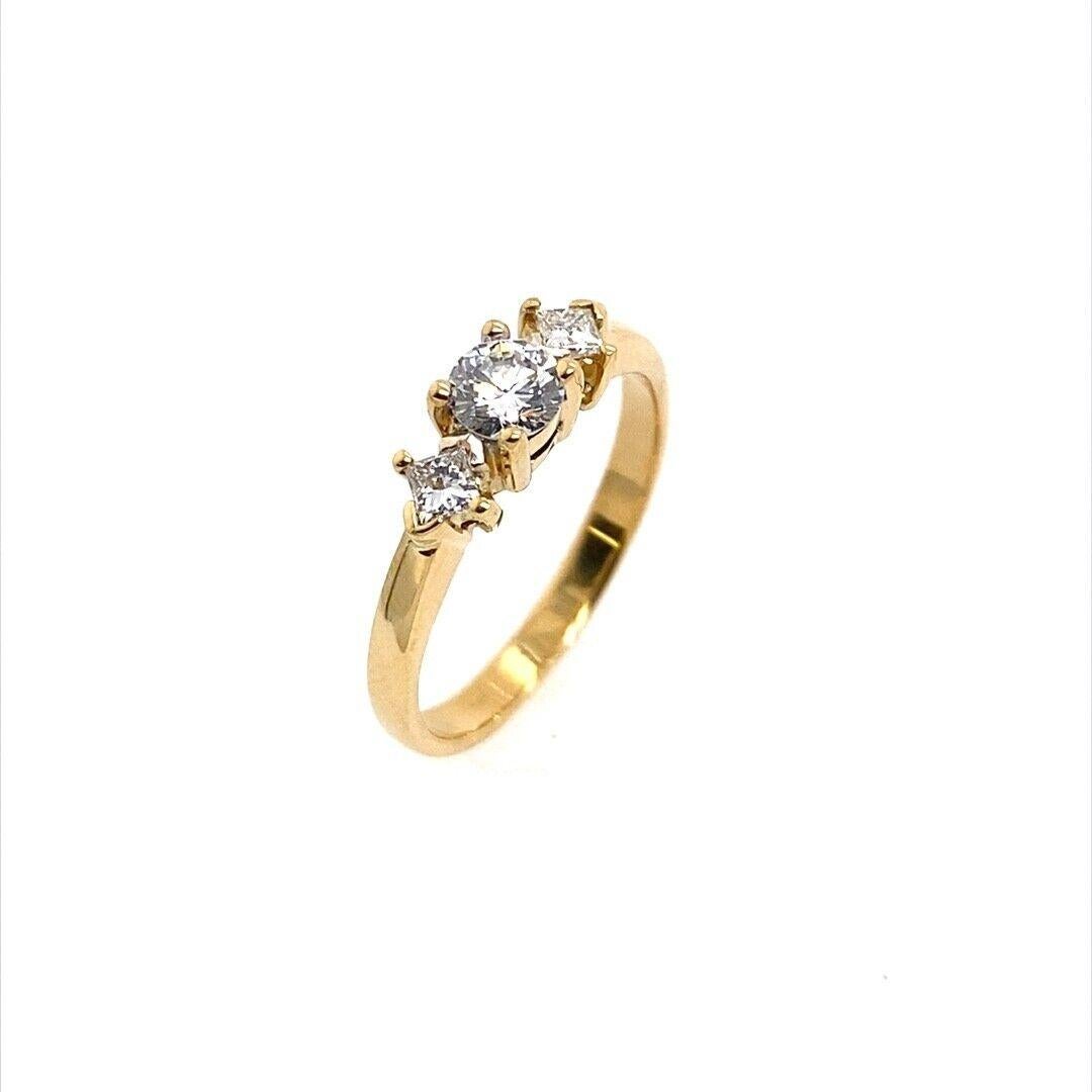 This ring is set with 3 Princess cut diamonds. The diamonds are set in a beautiful 18ct yellow gold setting. This ring is a very elegant style, perfect for any occasion. (Hallmark worn).

Additional Information: 
Total Diamond Weight: 0.50ct
Diamond