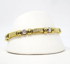 Pulsera de eslabones y diamantes redondos Oro amarillo y blanco de 18 quilates Estaciones redondas