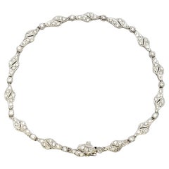 Round Diamond and Milgrain Accented Tennis Bracelet in 18 Karat White Gold