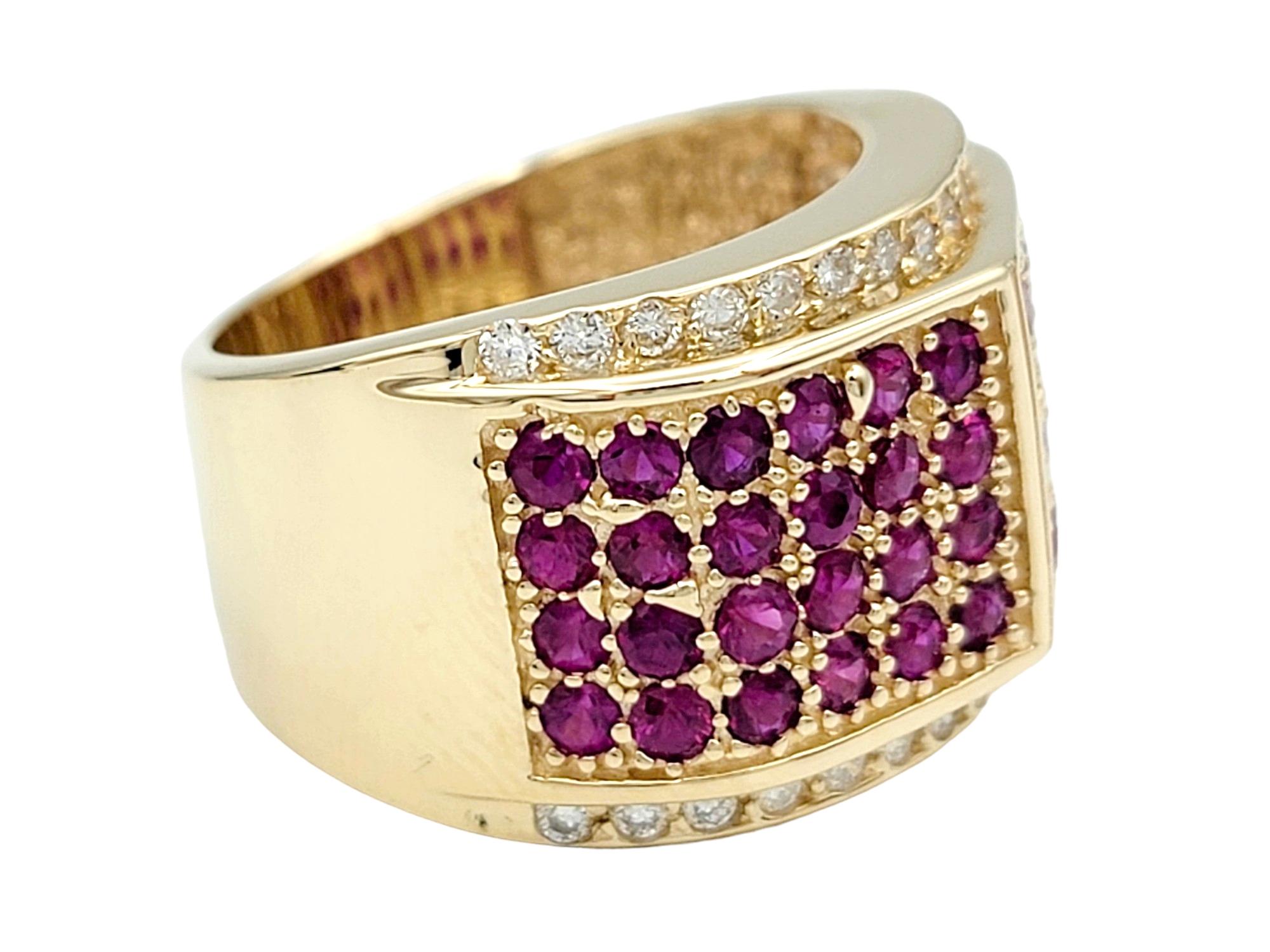 Ring Size: 7.25

This gorgeous diamond and lab sapphire band ring, set in lustrous 14 karat yellow gold, is a striking and luxurious piece. The wide band design allows for a bold statement, and the intricate arrangement of pink lab sapphires