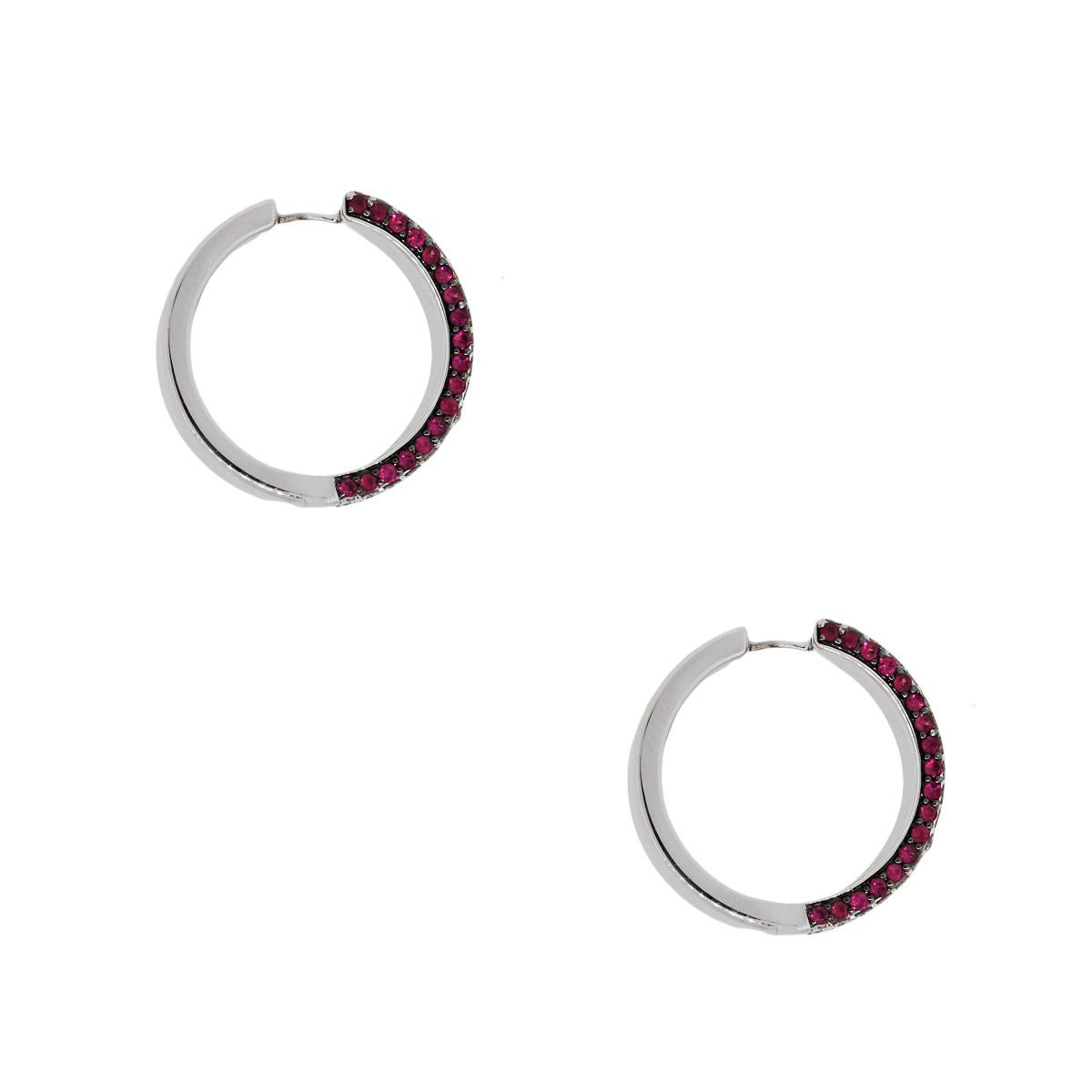 Style: 18k White Gold Round Diamond and Ruby Earrings
Material: 18k White Gold
Measurements: 0.90″ x 0.40″ x 0.90″
Diamond Detail: Approximately 1.85ctw of Round Diamonds. Diamonds are G in color and VS in clarity
Gemstone Details: Approximately