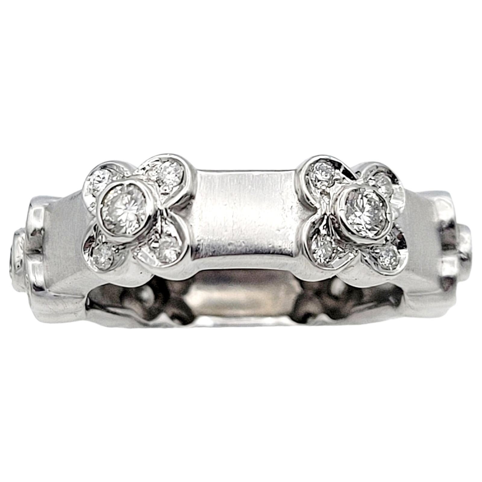 Ring Size 6.5

We absolutely adore this amazing 14 karat white gold diamond flower station ring. Delicately crafted, this captivating and contemporary piece features six meticulously arranged flower motifs, each adorned with five bezel-set natural