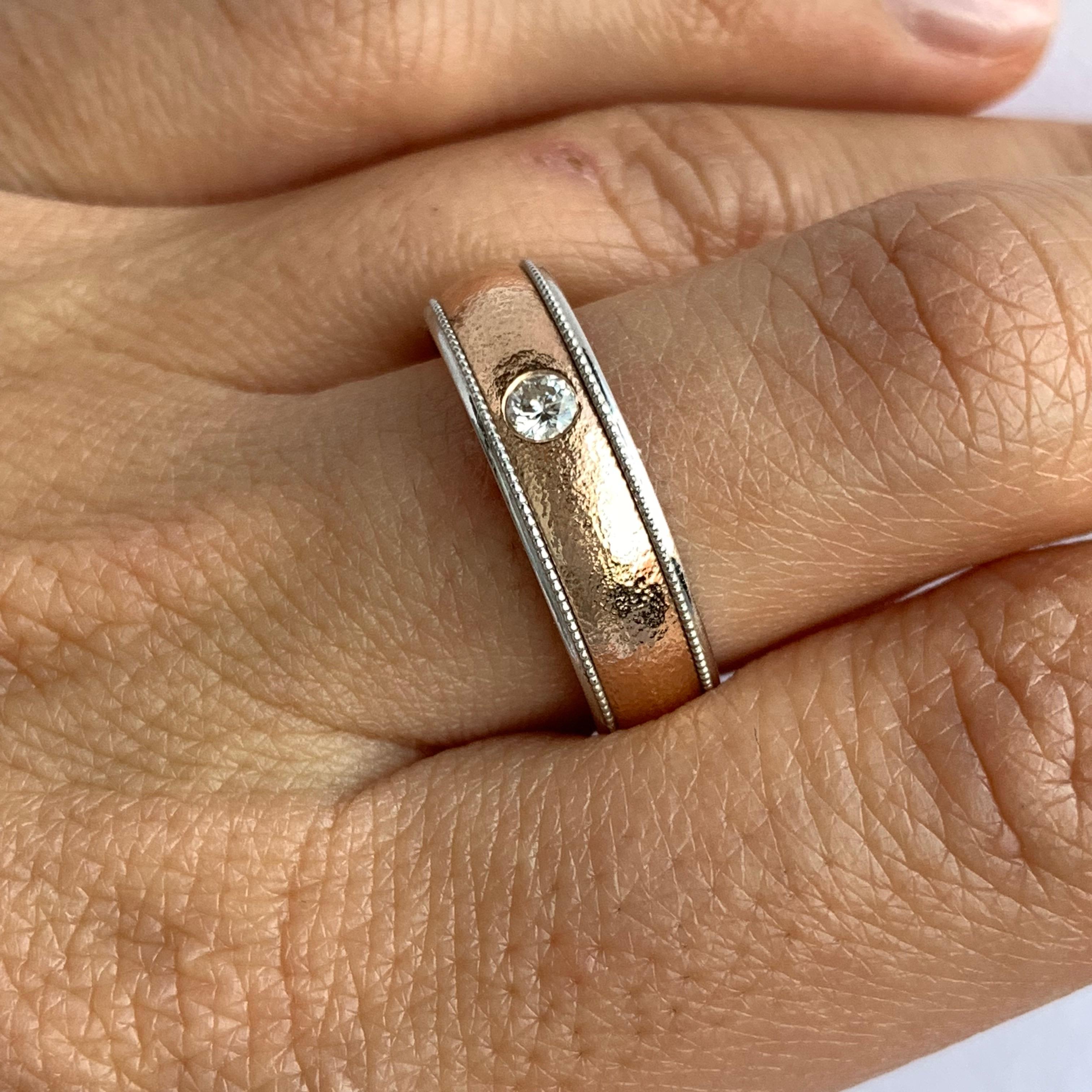 The perfect style for men or women!

Material: 14k Two Tone
Center Stone Details: 0.10 Carat Round White Diamond-Clarity: SI / Color: H-I
Ring Size: Size 8.5. This ring cannot be sized but can be remade in any size!

Fine one-of-a-kind craftsmanship