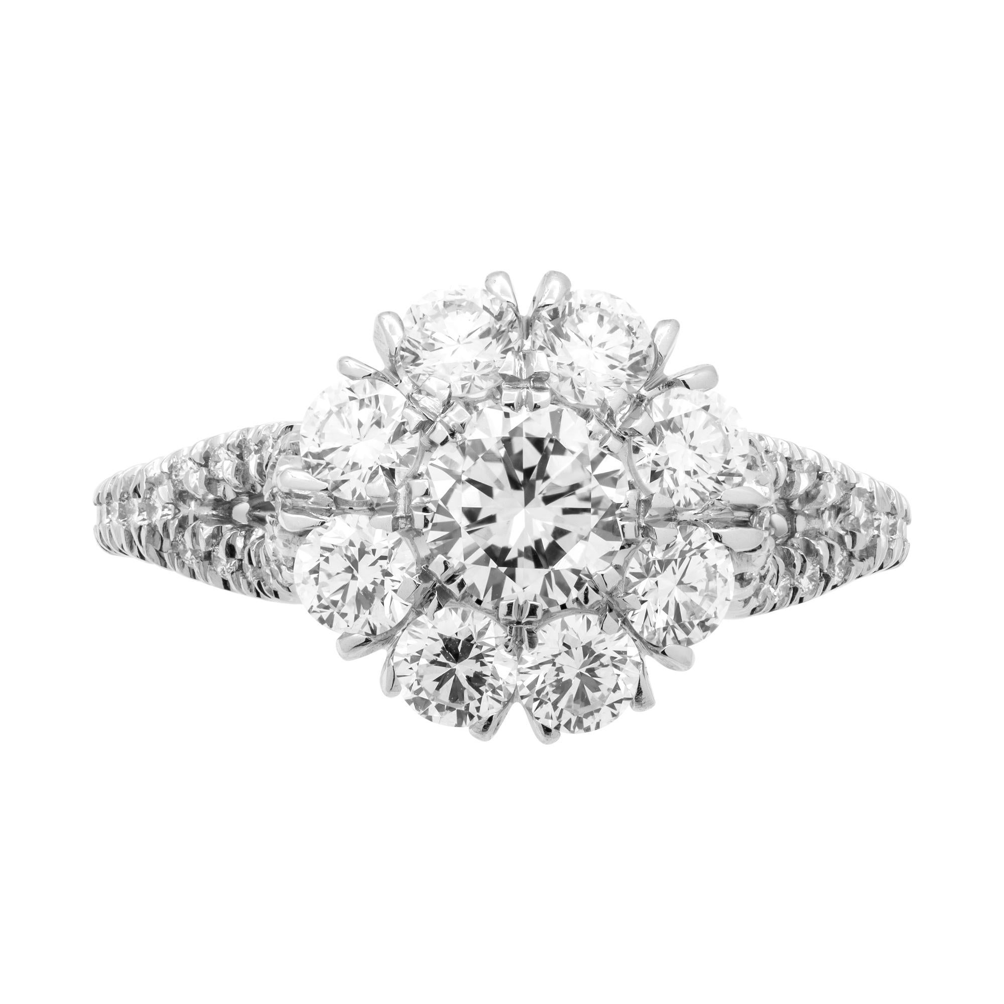 Mounted in handmade custom design setting featuring Platinum 950, 8 white full cut diamonds that form a beautiful flower (looks like 4ct solid round stone!), pave diamonds are encrusted all over the shank that splits into beautiful arch when meets