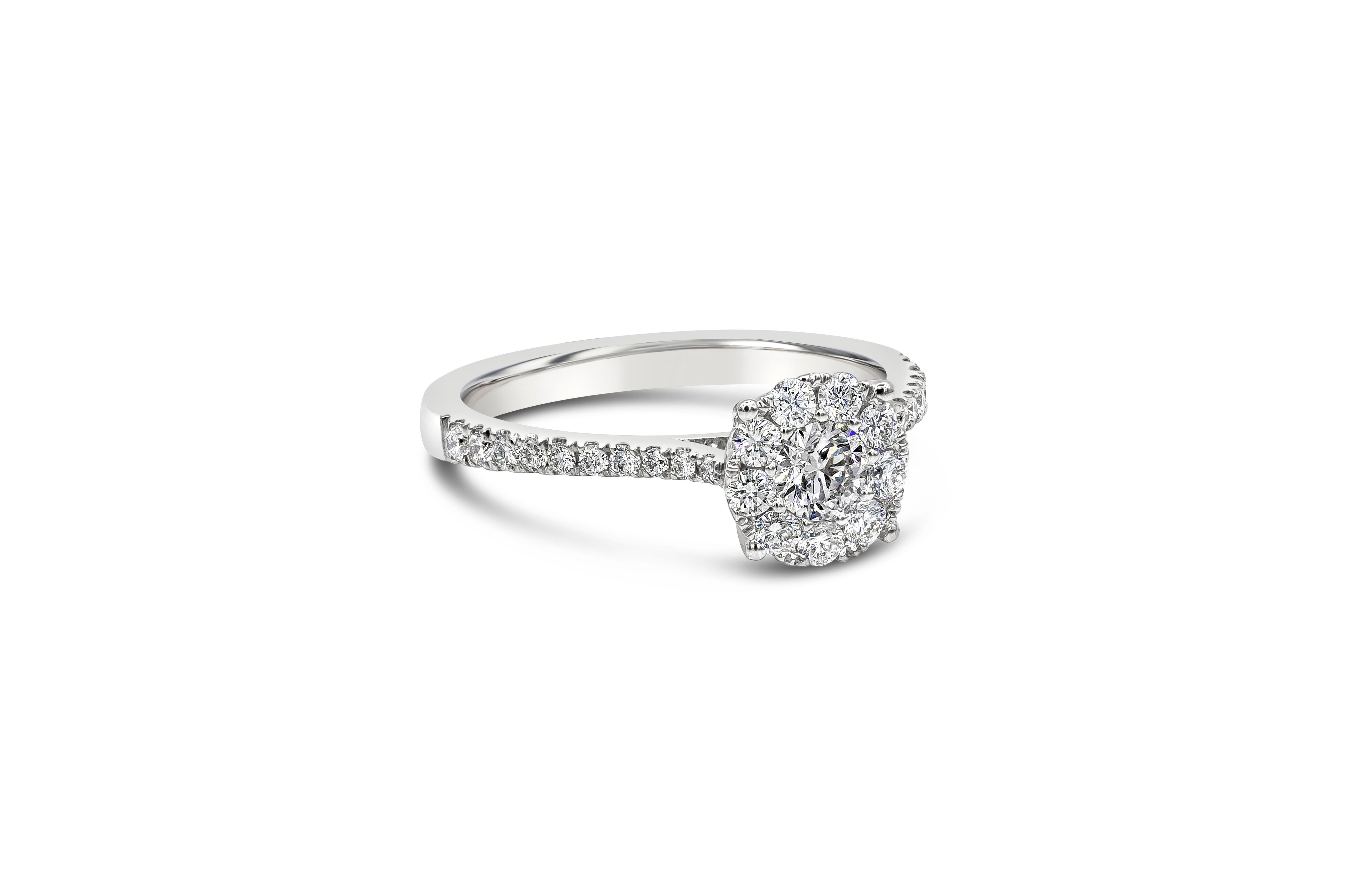 A classic  and budget-friendly engagement ring style showcasing a cluster of round brilliant diamonds that looks like one center diamond. Set in a tapered pave setting made in 18k white gold. Diamonds weigh 0.72 carats total. 

Style available in
