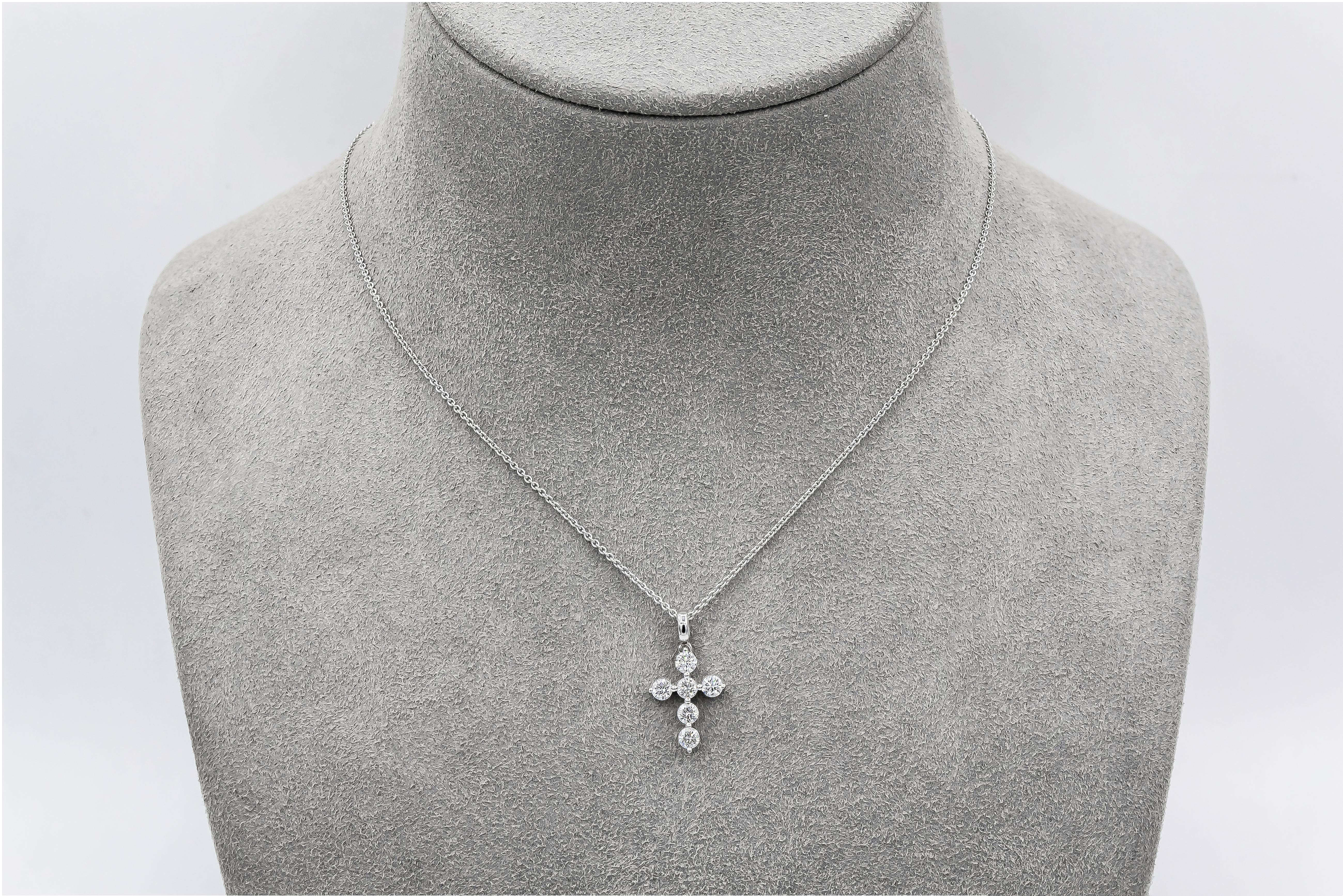 A classic religious pendant necklace showcasing six round brilliant diamonds, set in a cross made in 18 karat white gold. Diamonds weigh 0.64 carats total. 

Style available in different price ranges. Prices are based on your selection of the 4C’s