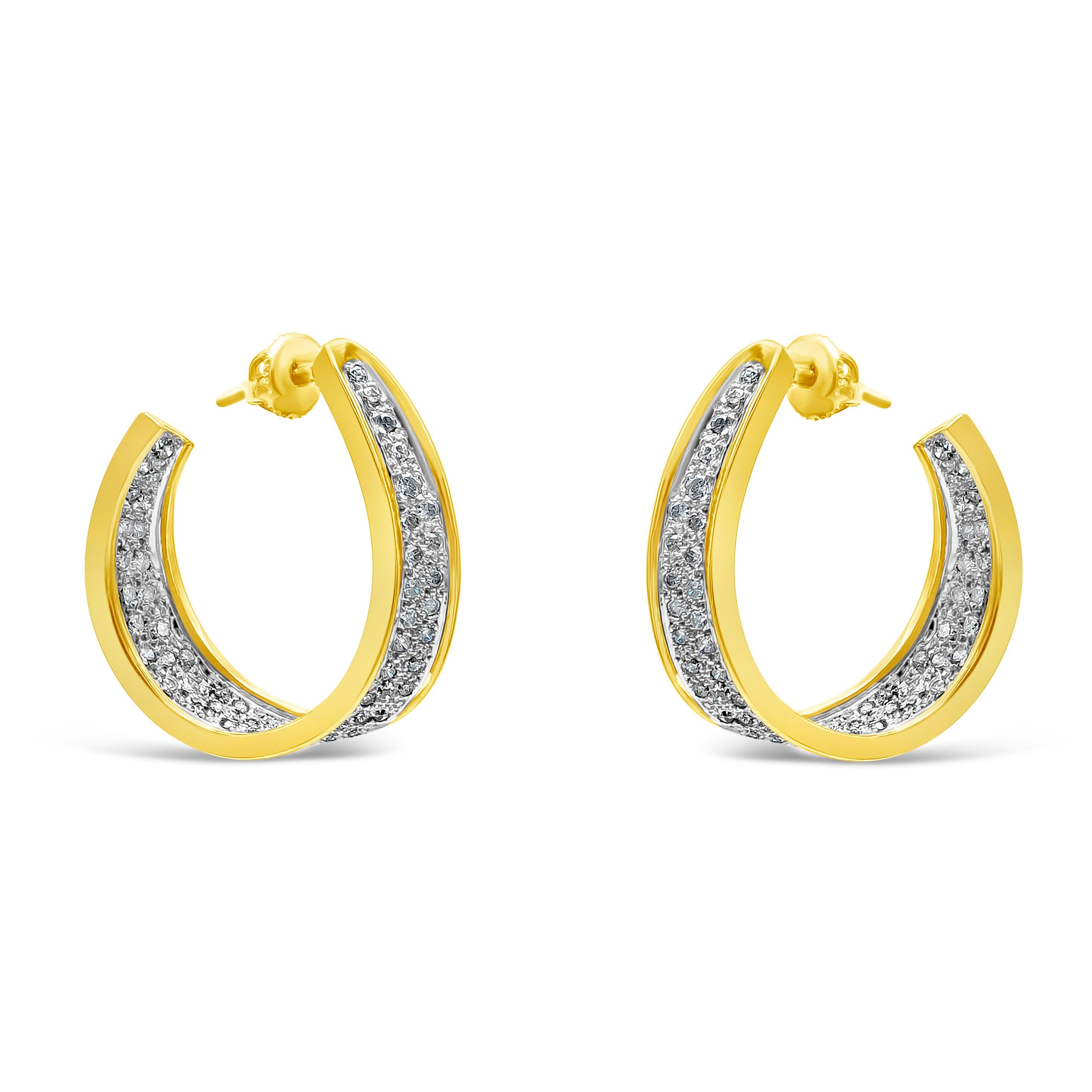 A unique hoop earrings style showcasing a cluster of round brilliant diamonds in a curved inside-out design. Diamonds weigh 2.20 carats total, F Color and I3 in Clarity. Made with 14K Yellow Gold.

Style available in different price ranges. Prices