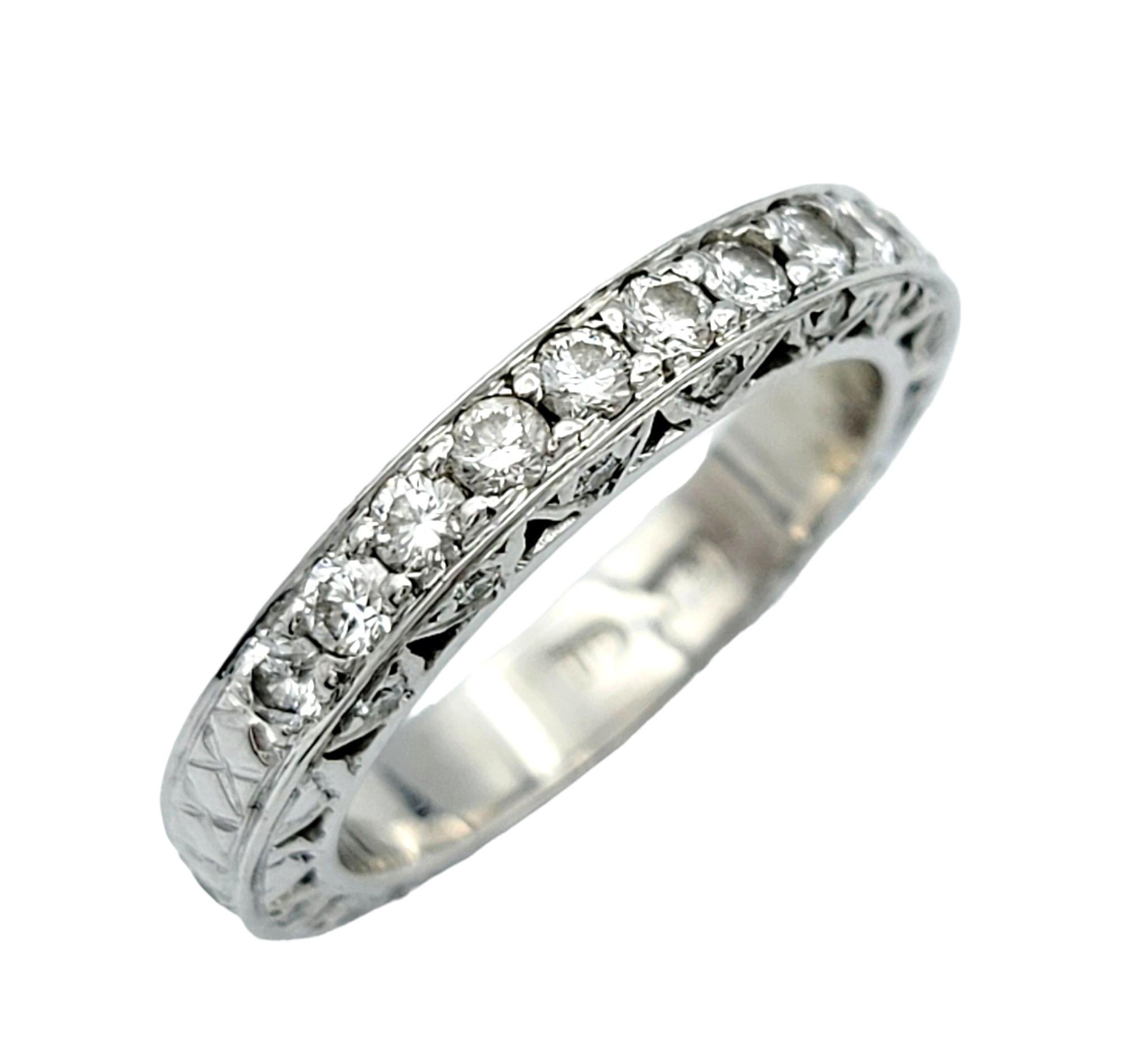 Ring Size: 5

Intricately crafted from exquisite 19 karat white gold, this diamond band ring epitomizes timeless elegance and sophistication. The centerpiece of this ring is a dazzling array of diamonds that wrap almost entirely around the band,
