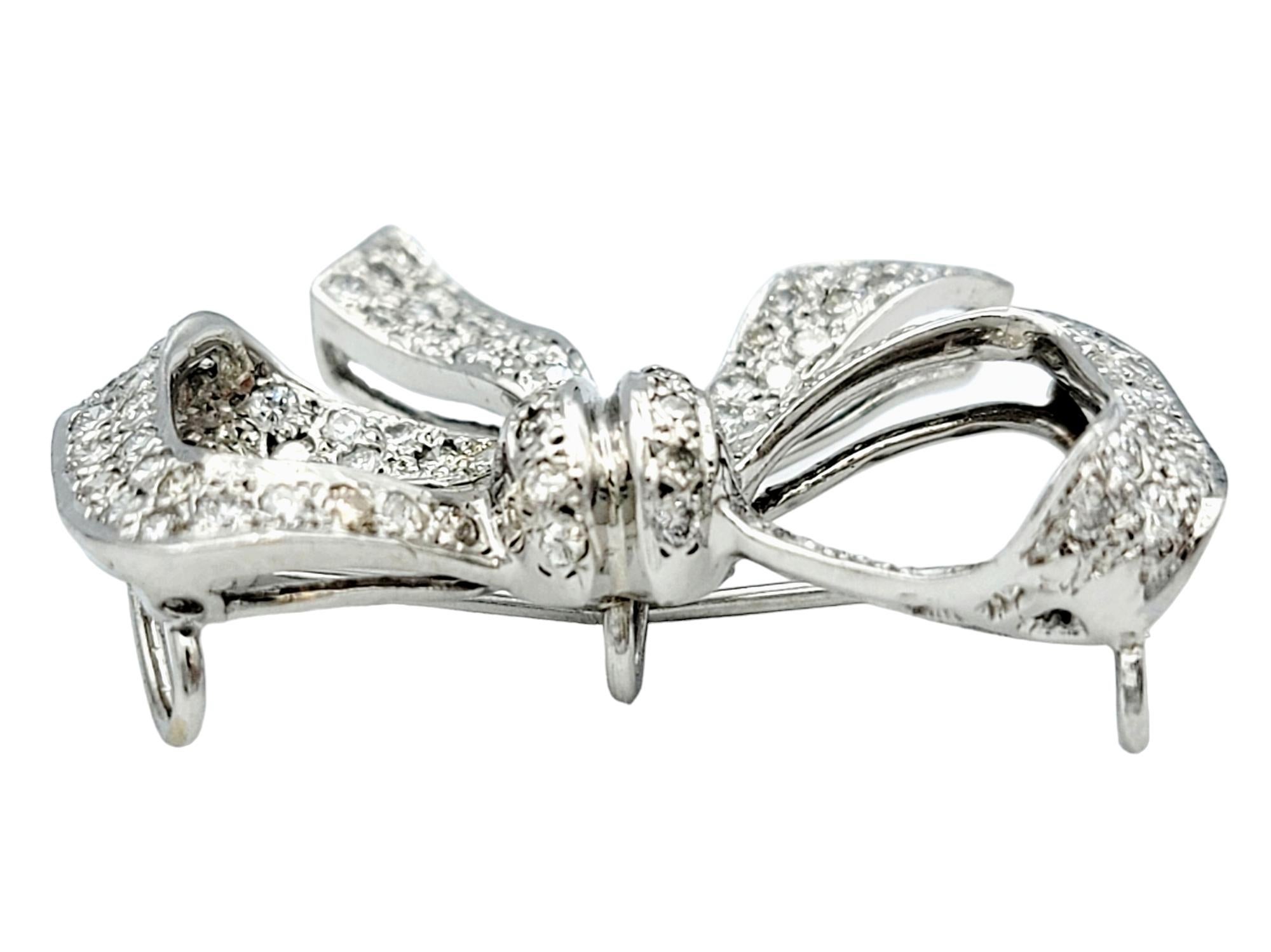 Contemporary Round Diamond Encrusted Ribbon Bow Brooch / Pendant in 14 Karat White Gold For Sale