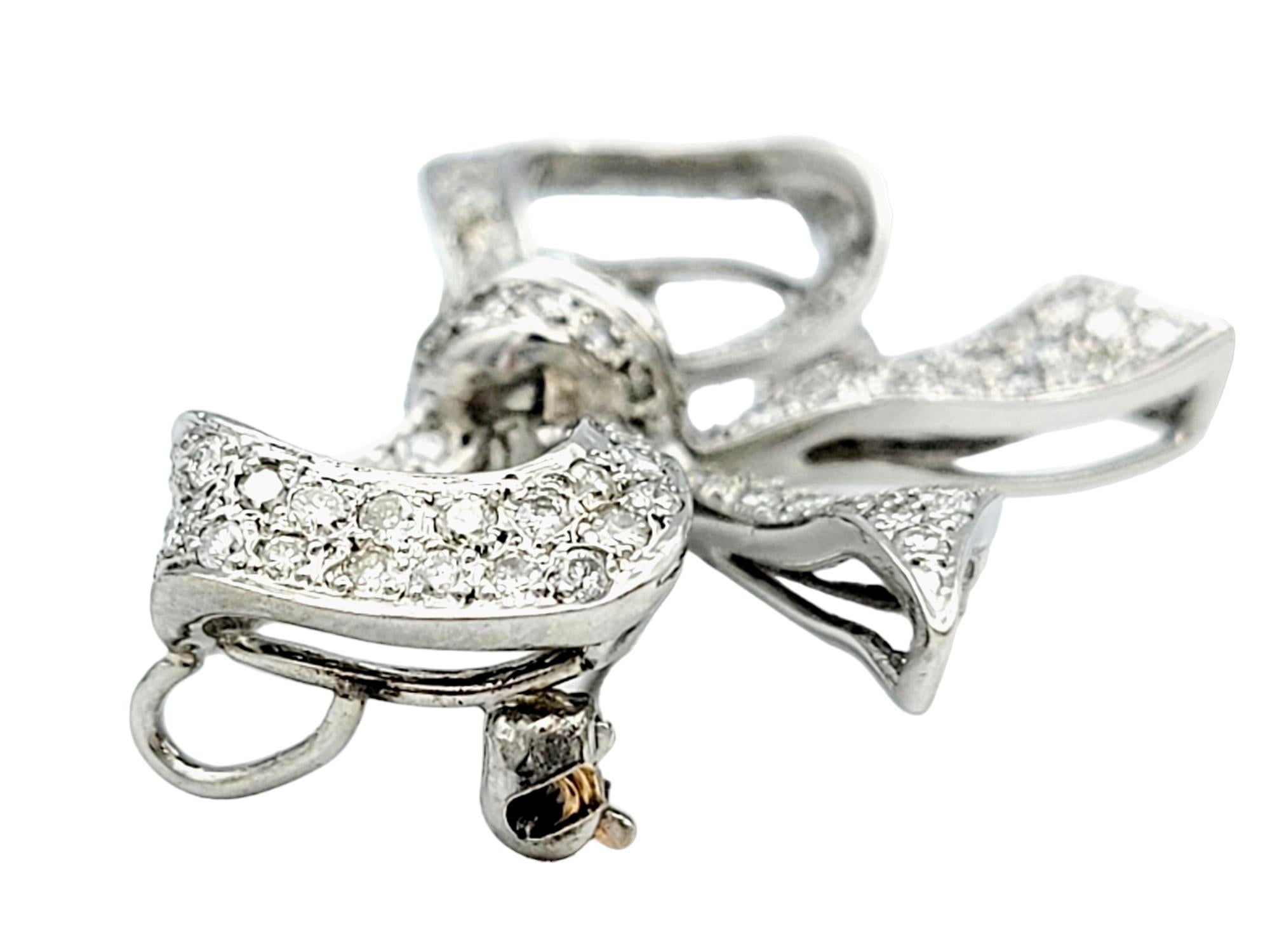 Round Cut Round Diamond Encrusted Ribbon Bow Brooch / Pendant in 14 Karat White Gold For Sale