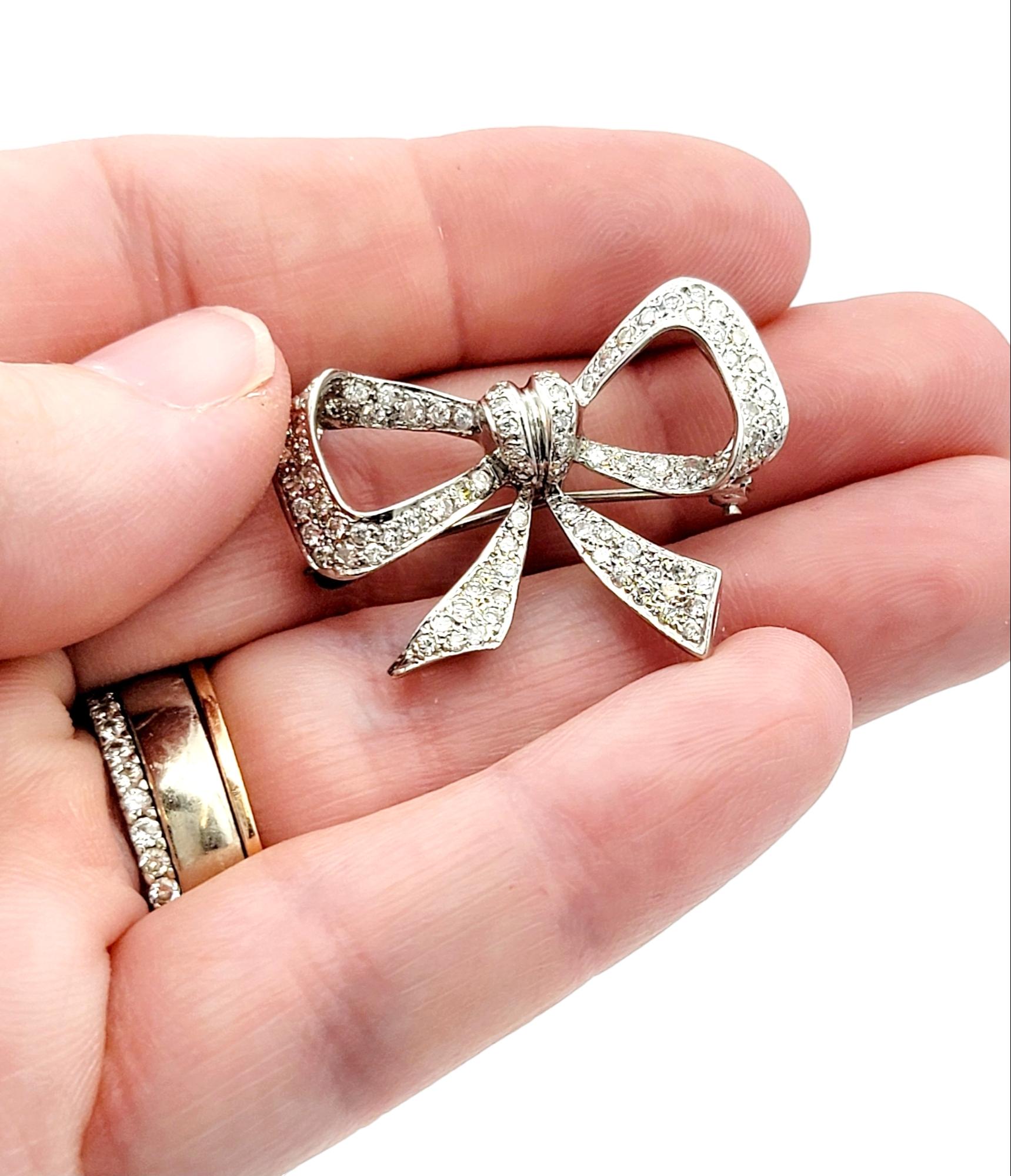Women's Round Diamond Encrusted Ribbon Bow Brooch / Pendant in 14 Karat White Gold For Sale