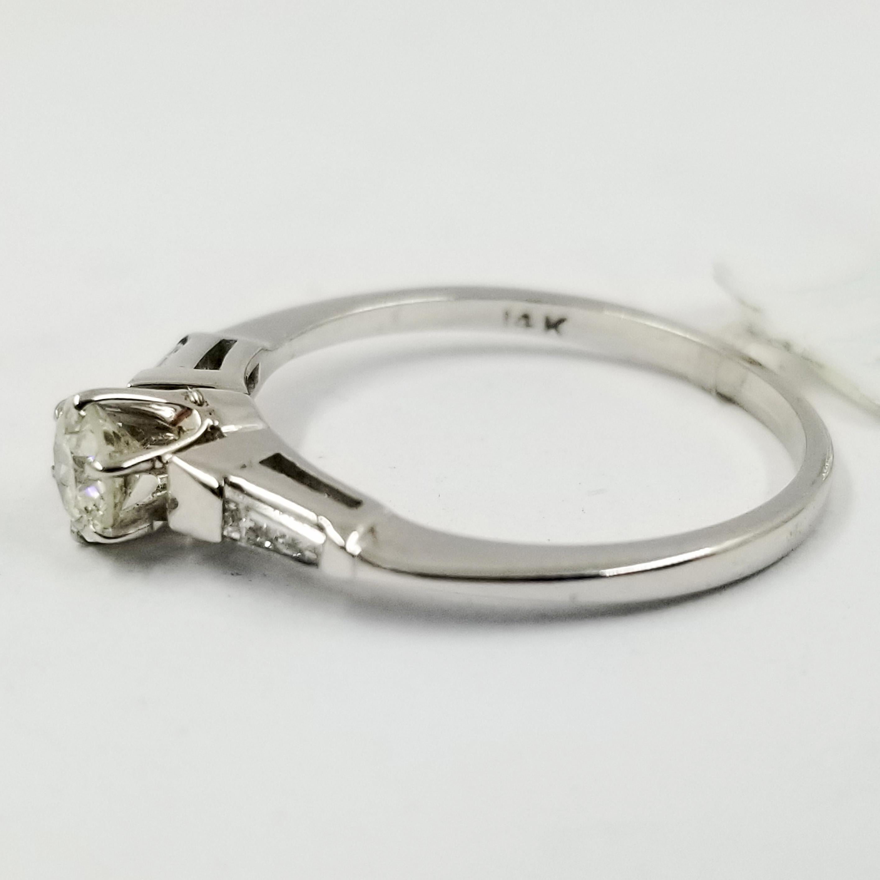 engagement ring with tapered baguette side stones