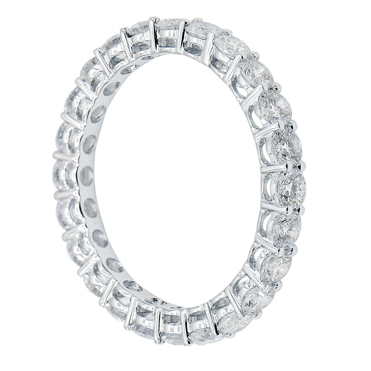 This gorgeous classic eternity band is perfect for everyone. This ring is made from 1.7 grams of 18 karat white gold. 23 beautiful VS2, G color diamonds totaling 1.85 carats are set all the way around the band for the perfect balance of gold to