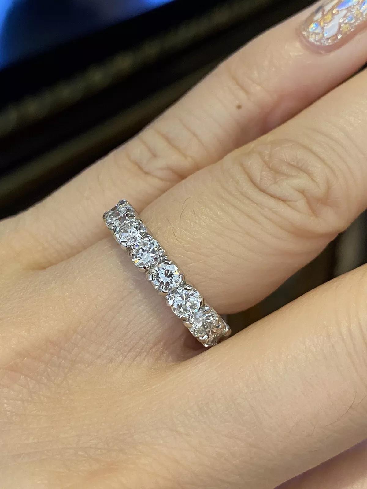 Round Diamond Eternity Band Ring 3.86 carat total weight in Platinum 4 mm Size 5.25 

Round Diamond Eternity Band Ring features 18 Round Brilliant cut Diamonds, averaging 0.214 carats each, individually prong-set in high-polished Platinum.

Total