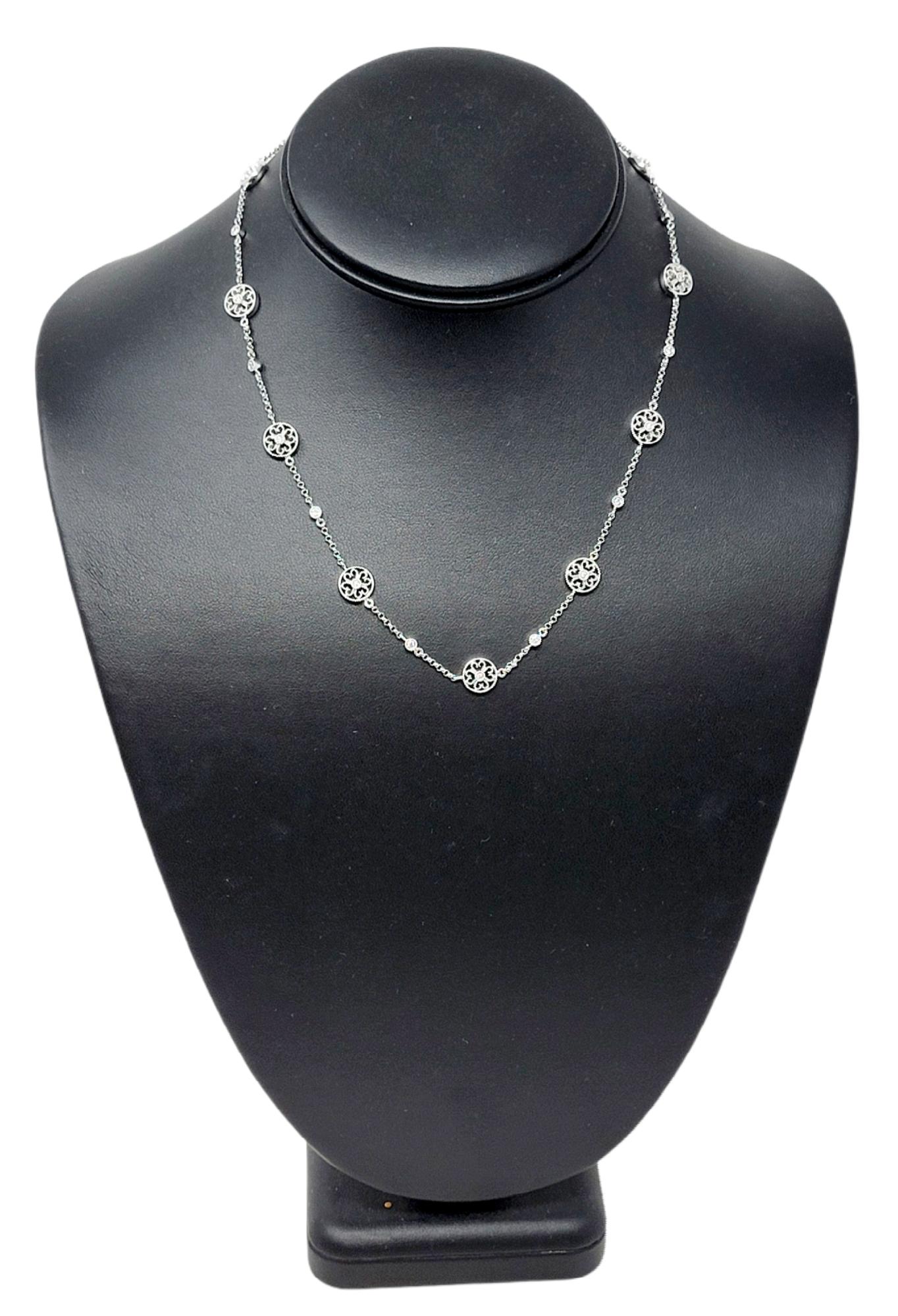 This gorgeous diamond station necklace is the perfect blend of simplicity and elegance.  Featuring a delicate chain and a sparkling floral motif, this lovely necklace goes with just about everything. This beautiful piece features 11 diamond
