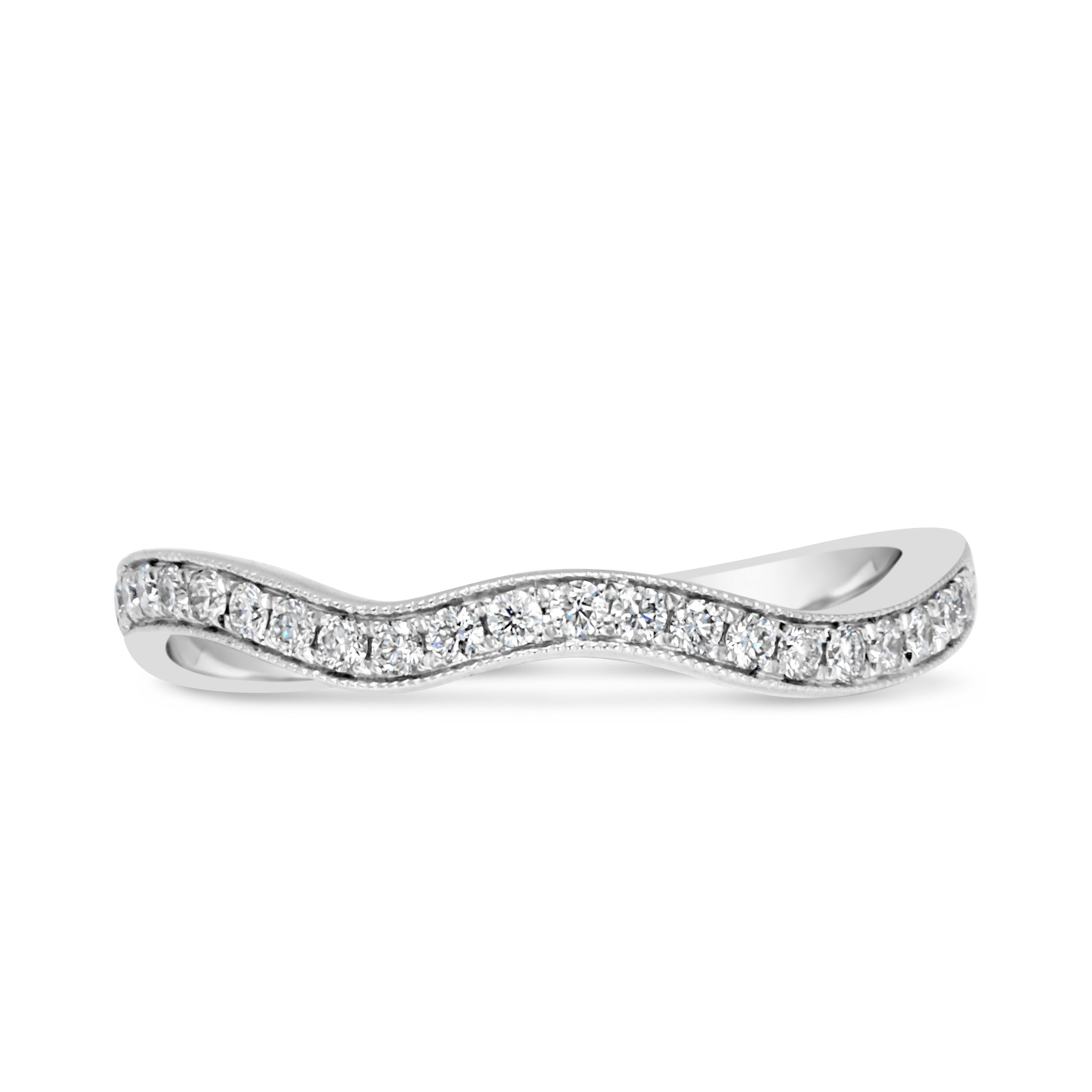 infinity wedding band with halo engagement ring