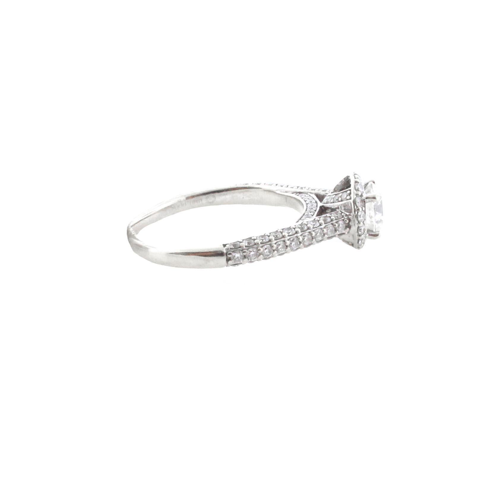 This ring is truly a classic. Brides are often seen wearing an engagement ring looking very similar to this.
A 14 Kt white gold ring with a round center stone weighing 0.61 carats. The stone is estimated to be an H in color and I1 in clarity. The
