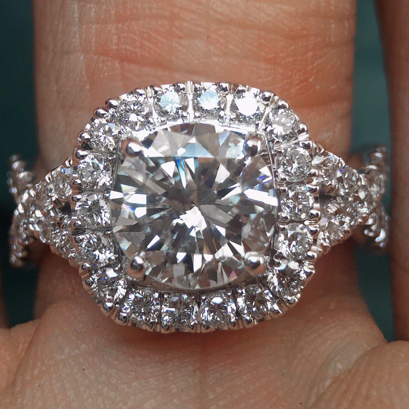 Round Diamond Halo Engagement Ring - 1.2 Center - 1.7 Carat Total
Ring May be made to order from scratch to accommodate your exact finger size 
or a different stone if the budget requires it, takes approximately 3-6 business weeks
Setting with no