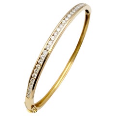 Round Diamond Hinged Narrow Bangle Bracelet in 14 Karat Yellow Gold