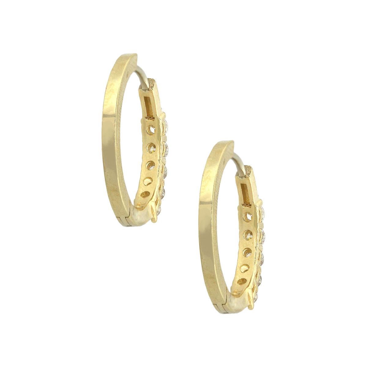 Material: 14k Yellow Gold
Diamond Details: Approx. 1.07ctw of round brilliant diamonds. Diamonds are G/H in color and SI in clarity
Measurements: 0.80″ x 0.10″ x 0.83″
Earrings Backs: Tension post
Total Weight: 5g (3.2dwt)
SKU: A30312428