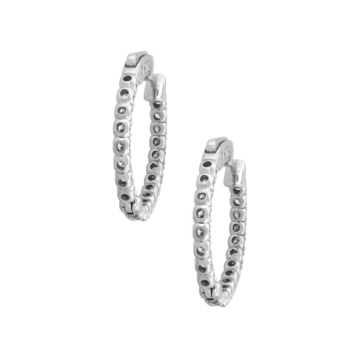 Material: 14k White Gold 1.60ctw
Diamond Details: Approximately 1.60ctw of round brilliant diamonds. Diamonds are G/H in color and SI in clarity
Measurements: 0.81″ x 0.11″ x 0.80″
Earrings Backs: Hinged Backs
Total Weight: 6.5g (4.2dwt)
SKU: