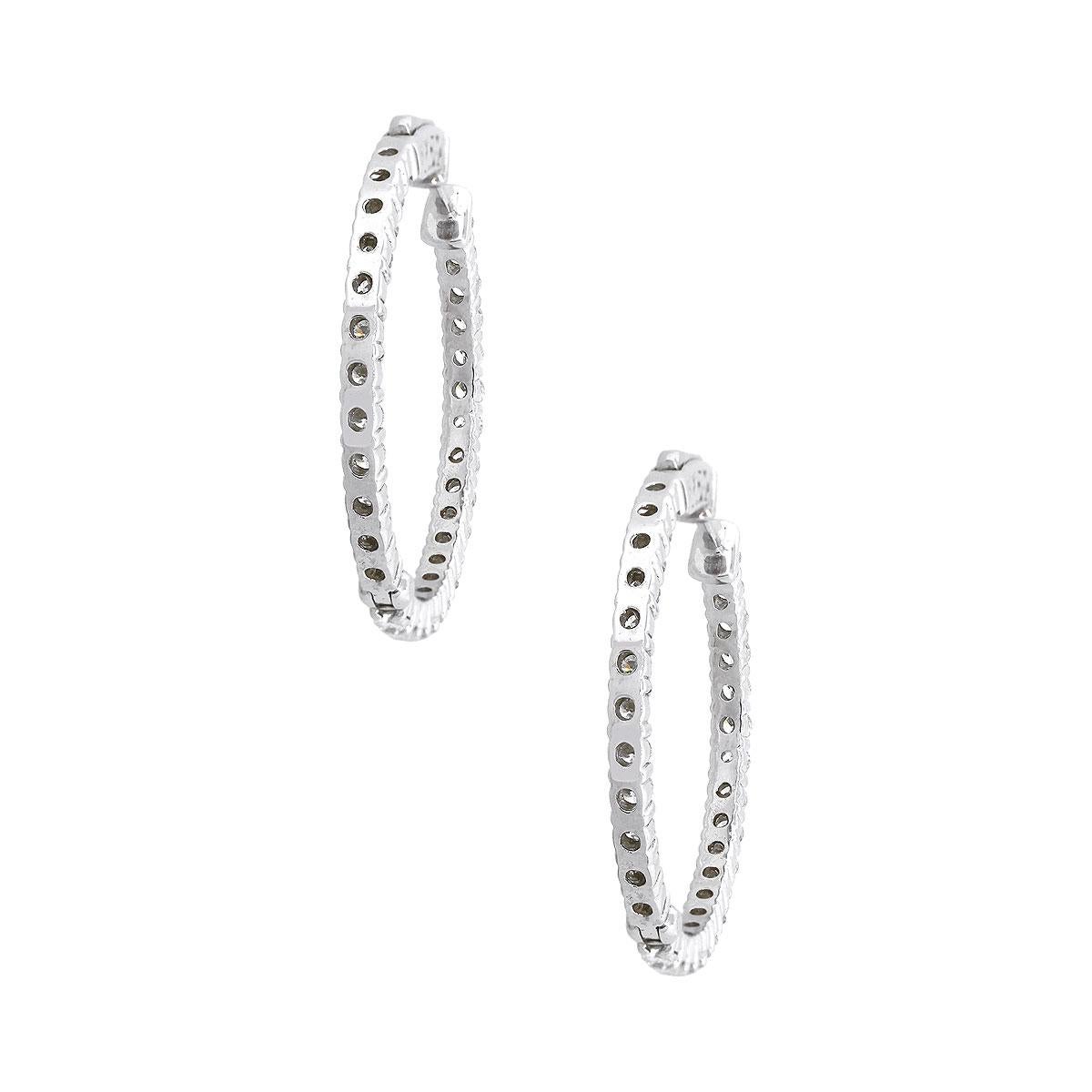 Material: 14k White Gold
Diamond Details: Approximately 2.81ctw of round brilliant diamonds. Diamonds are G/H in color and SI in clarity
Measurements: 1″ x 0.11″ x 1″
Earrings Backs: Hinged Backs
Total Weight: 8.8g (5.7dwt)
SKU: A30312430