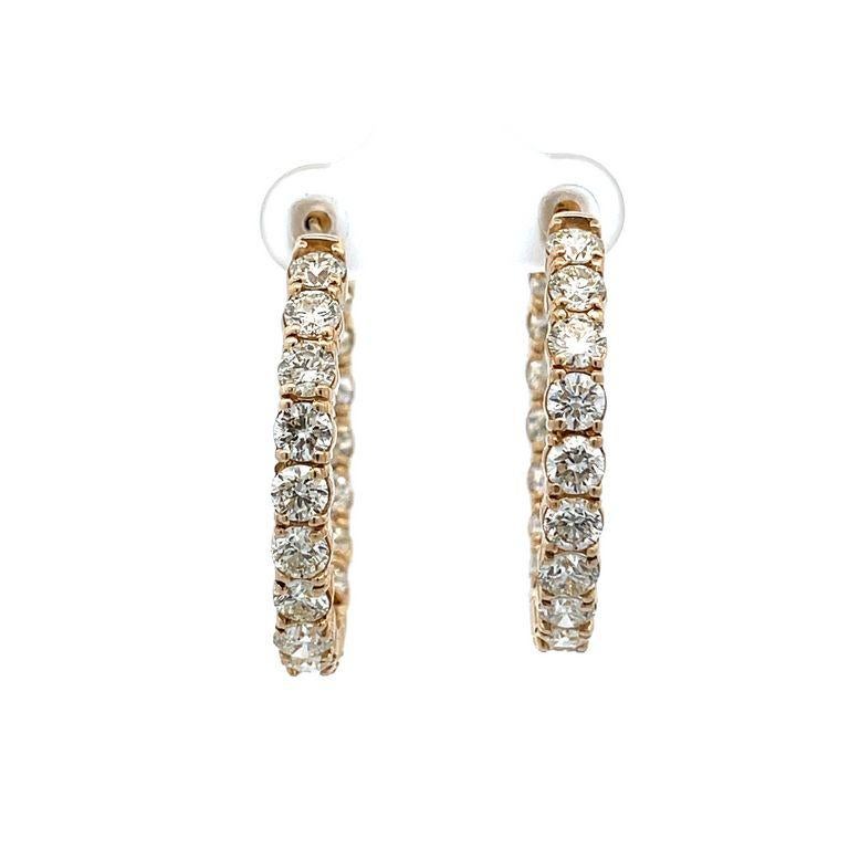 These earrings feature an endless inside-out round hoop design for sparkle from every angle. These earrings are made with white round diamonds and feature 36 stones, every stone is 0.20 pointers, these elegant hoop earrings have a total weight of