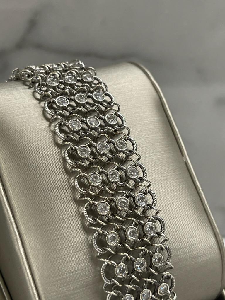 Don't wait to add this gorgeous, one of a kind bracelet to your collection ... 

With a mesh-style design, this bracelet has eighty-one (81) round diamonds laid throughout. The bracelet sits at 7.5