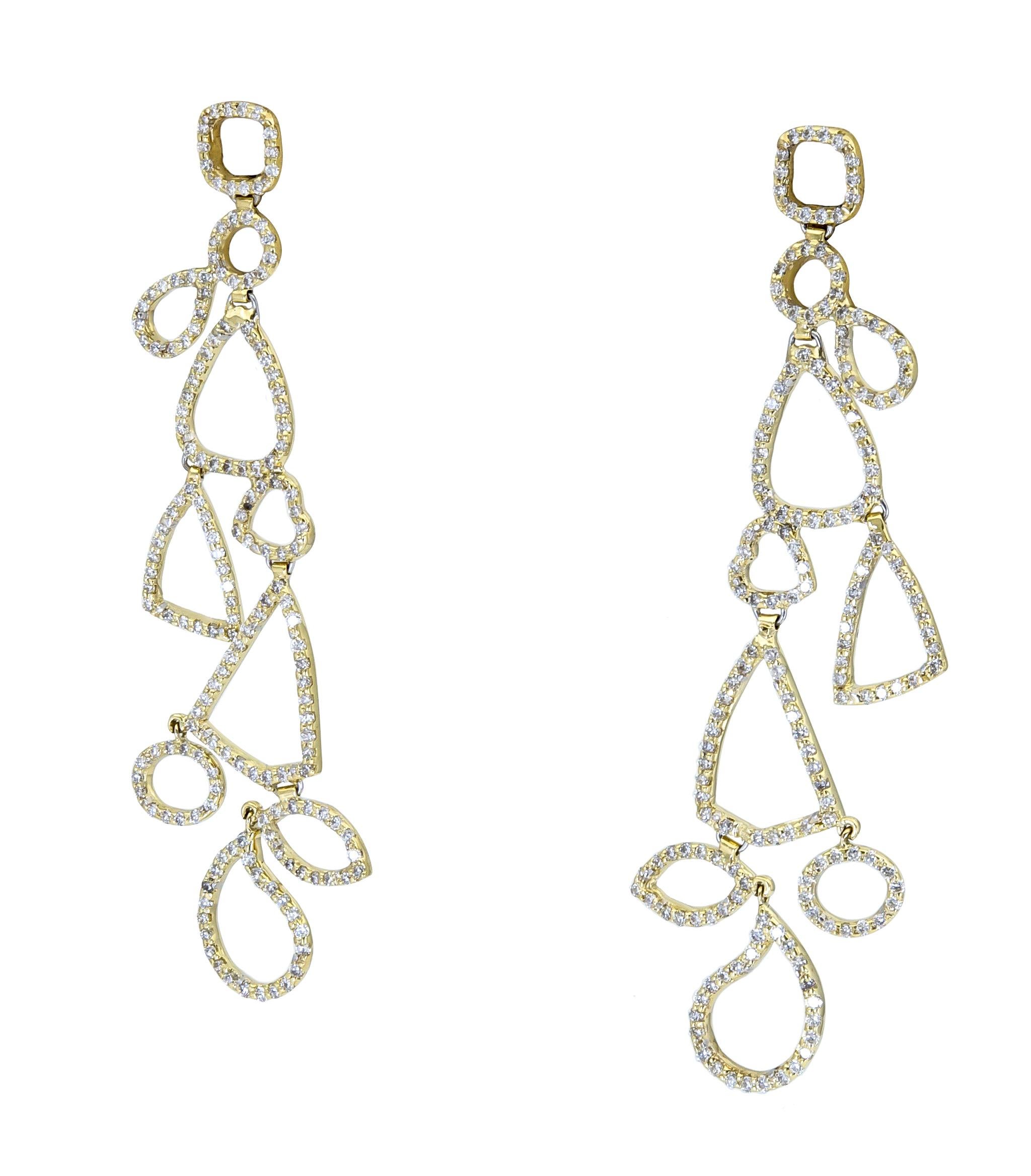 Modern design earrings showcasing open-work geometric shapes accented with round brilliant diamonds.
Made in 18k yellow gold.
Diamonds weigh 3.50 carats total.
Dimensions: 2.80in (L) x 1.10in (W)
Pushback earrings
Creator: Ely Adams