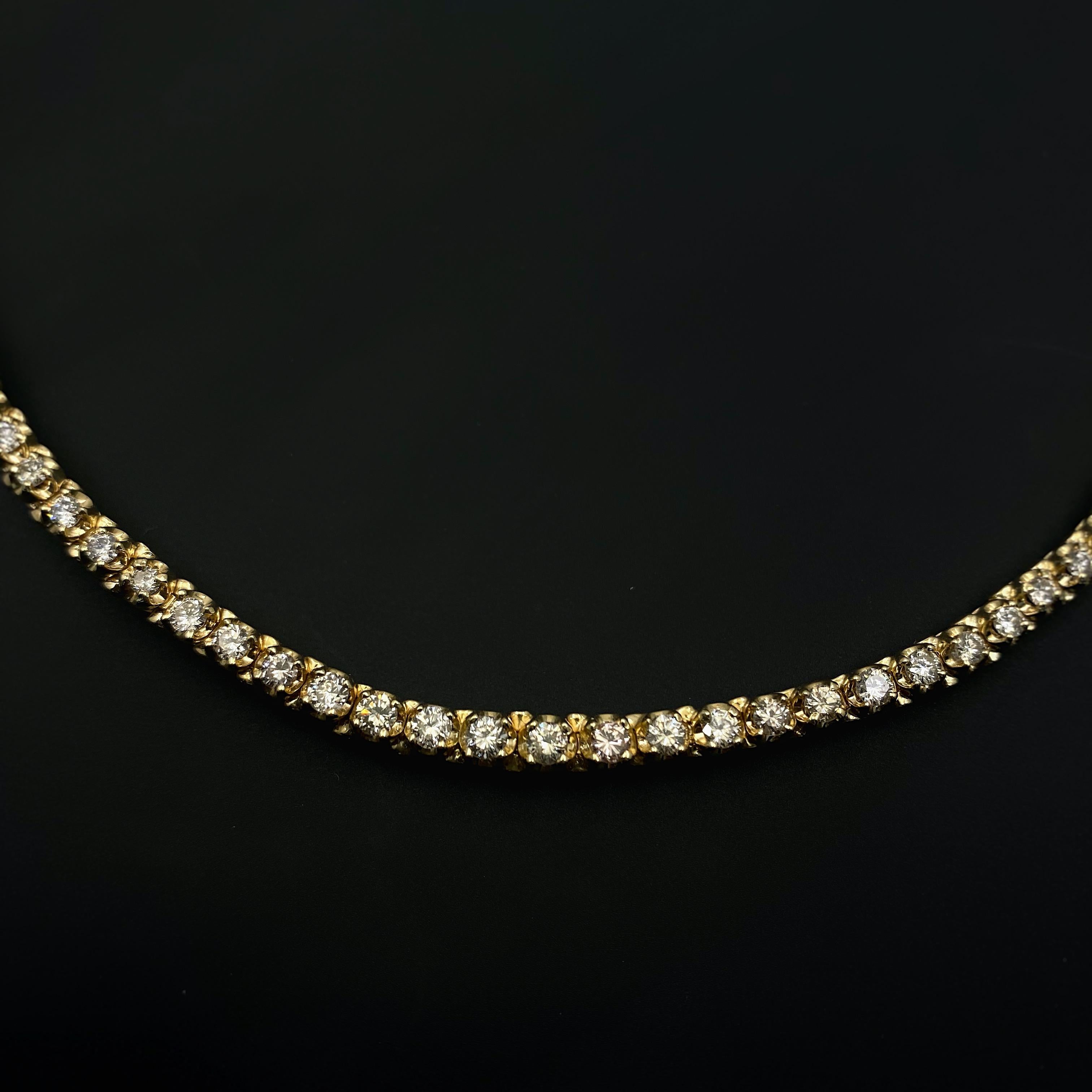 Round Diamond Tennis Necklace
Style:  Tennis
Metal:  14kt Yellow Gold
Length:  16' inches
Width:  3.6 MM
TCW:  5.50 tcw
Main Diamond:  111 Round Brilliant Diamonds 5.50 tcw
Color & Clarity:  J - K, SI1 - I1
Hallmark:14K
Includes:  Certified