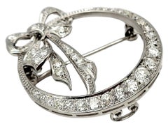Round Diamond Open Circle Brooch with Bow Detail in Polished Platinum