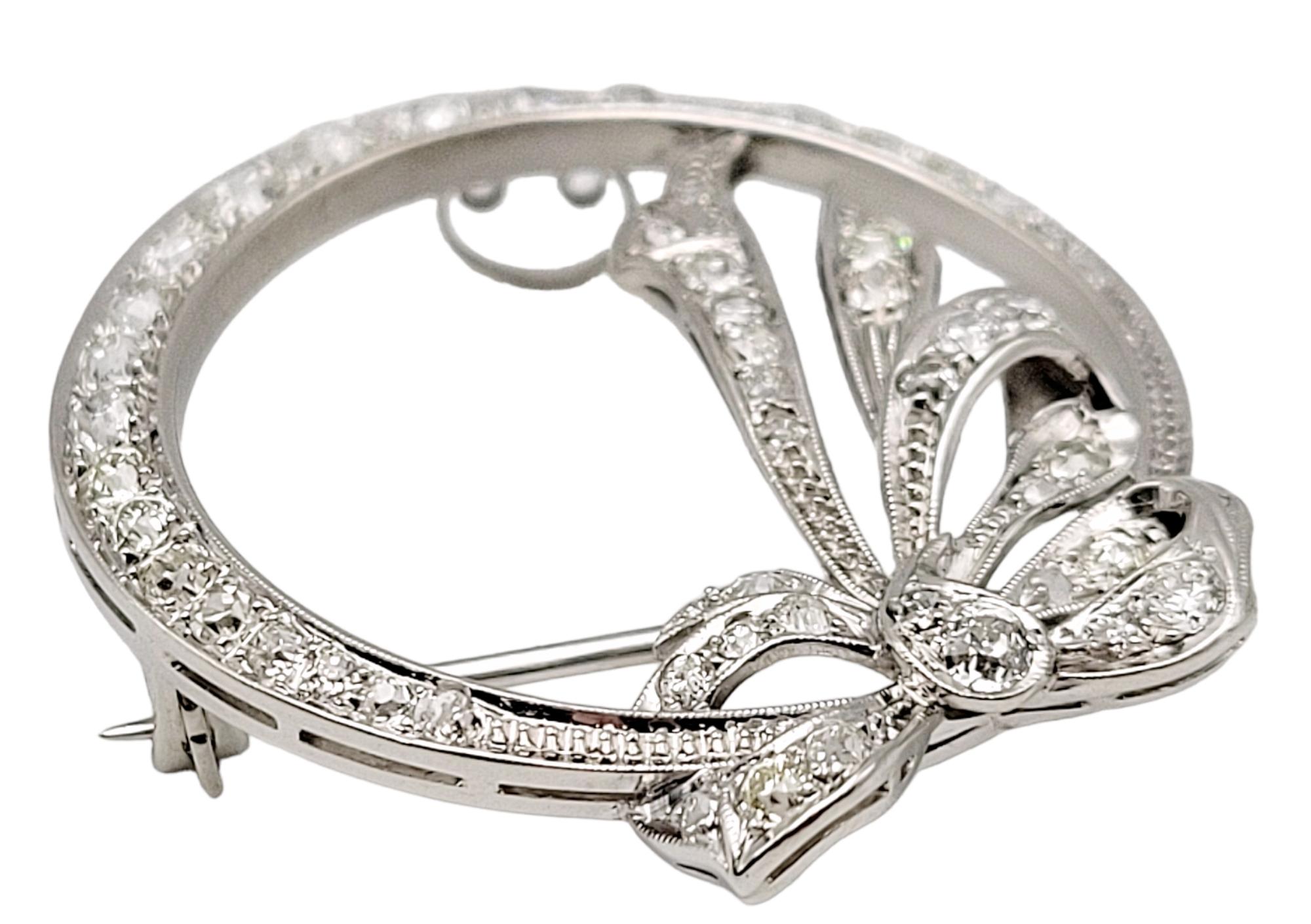 Women's Round Diamond Open Circle Brooch with Bow Detail in Polished Platinum