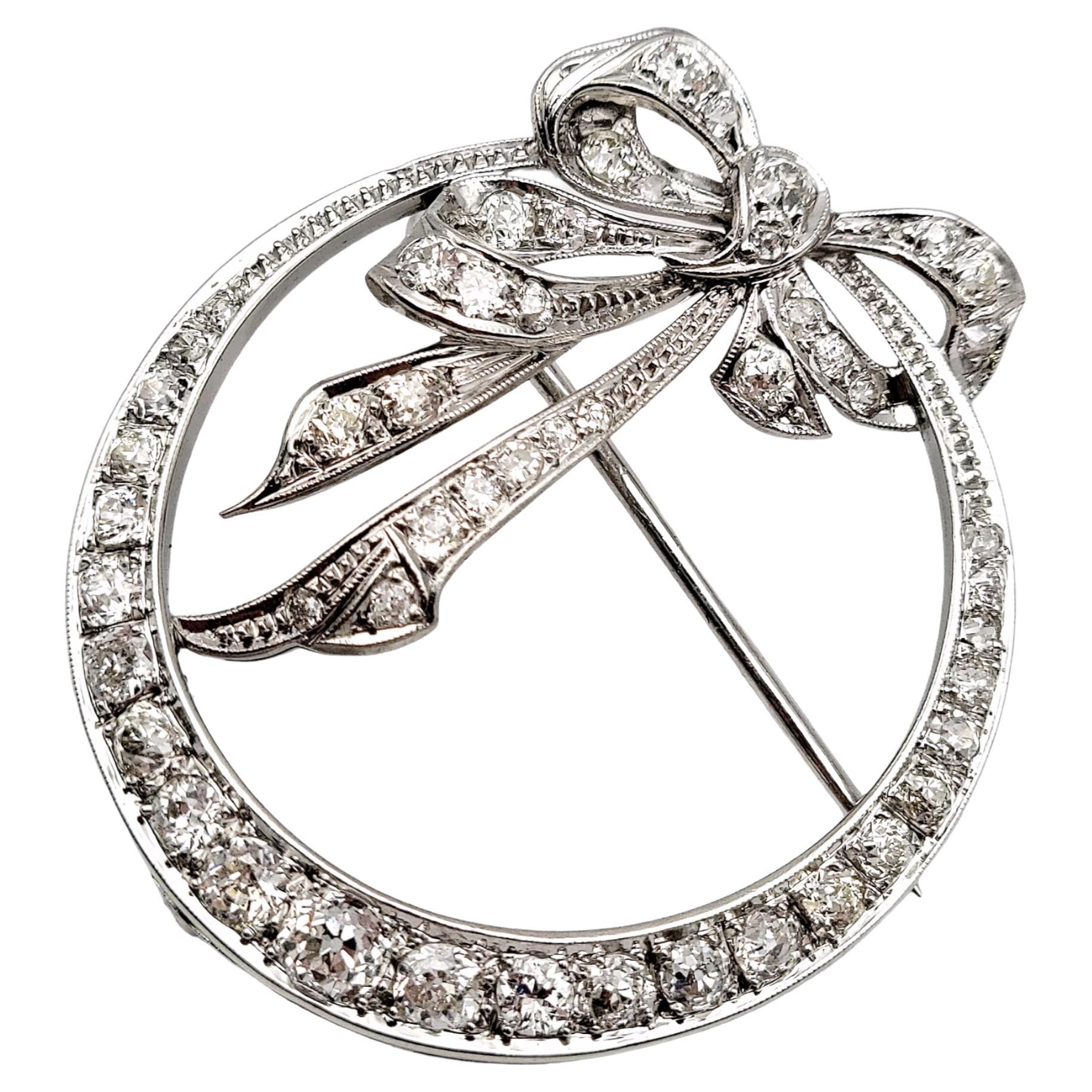 Round Diamond Open Circle Brooch with Bow Detail in Polished Platinum