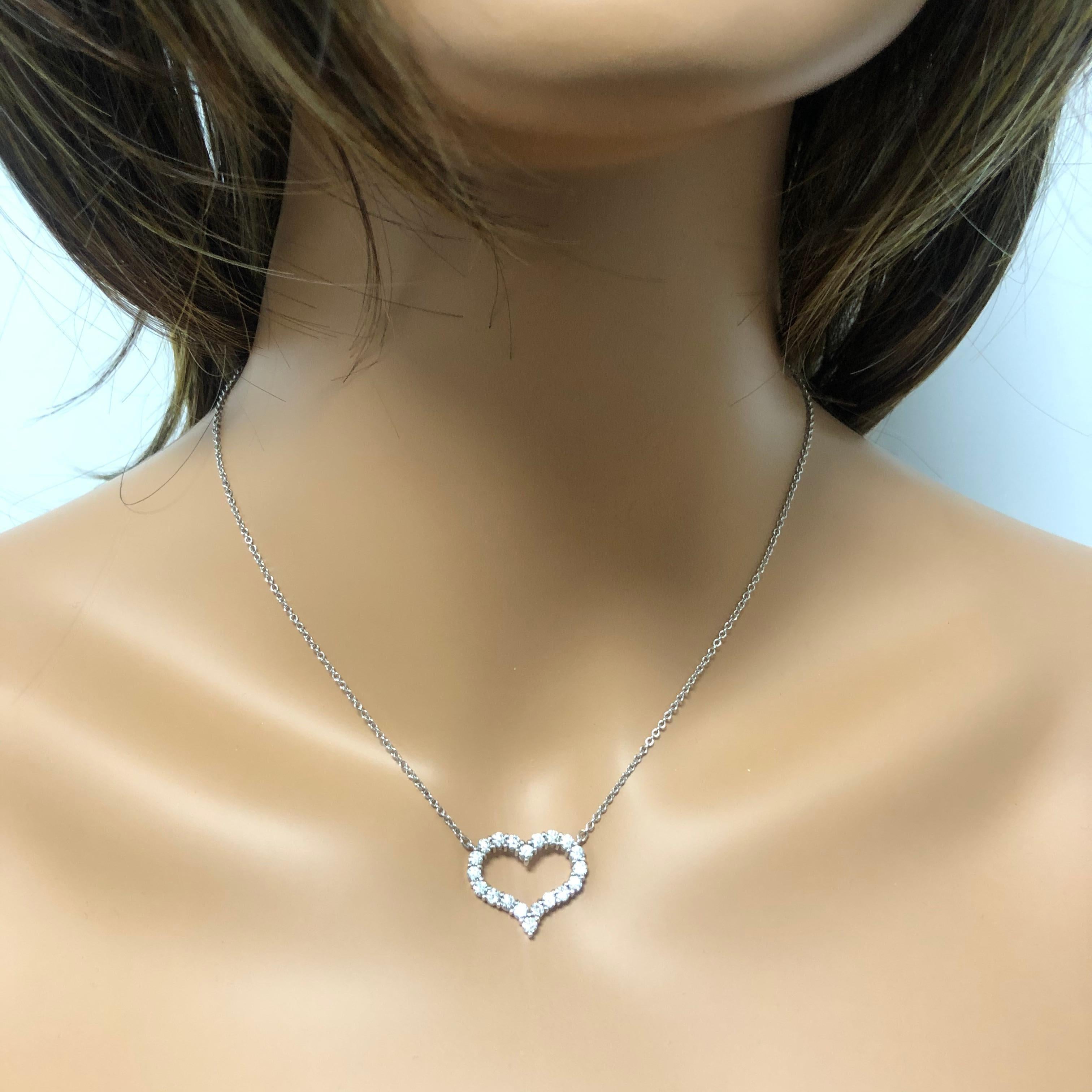 What better way to symbolize giving your heart to that special person than a diamond pendant necklace. This necklace showcases 20 sparkling round diamonds weighing 1.52 carats total set in a gorgeous open work design made with 14k white gold. Comes