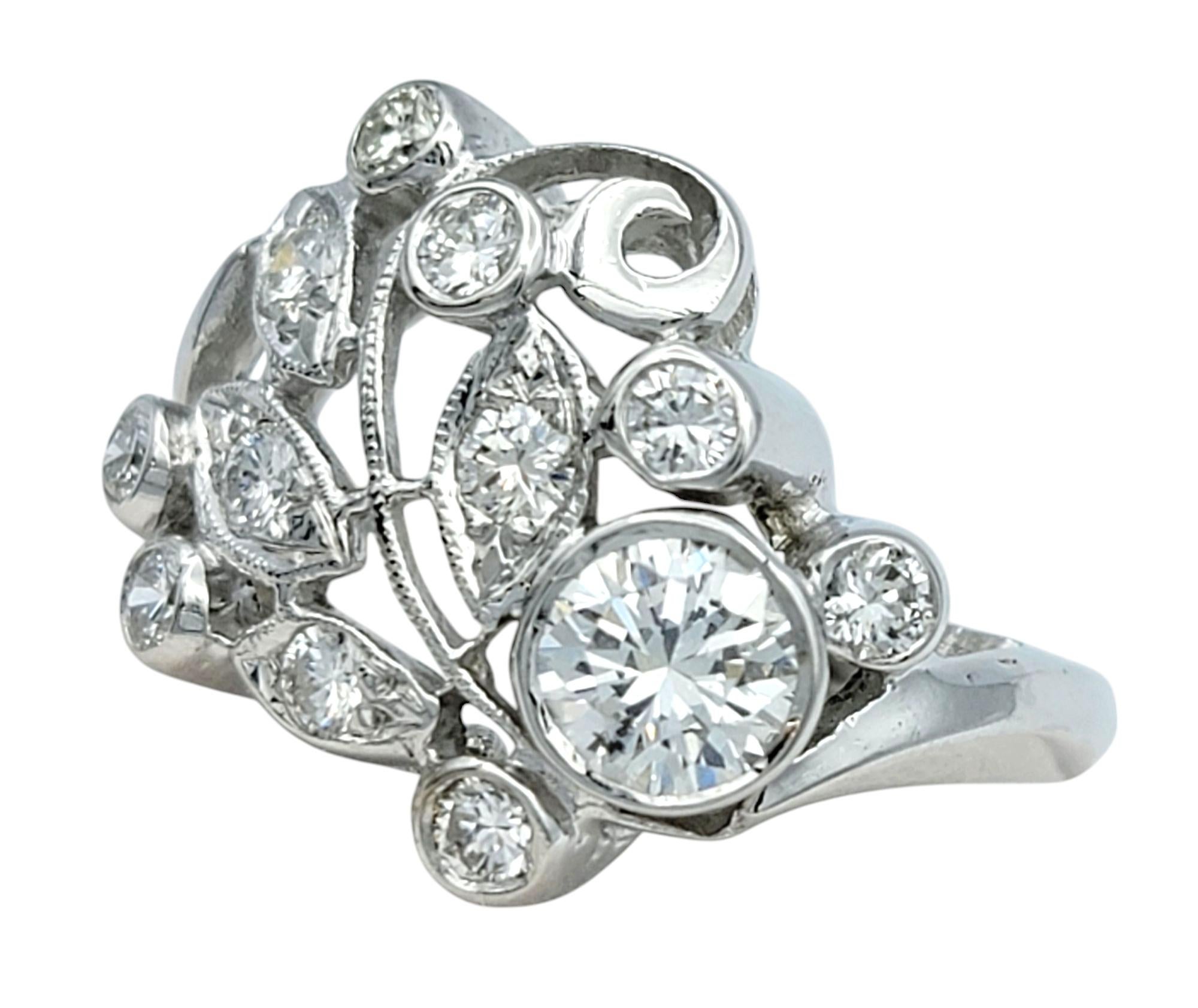 Ring Size: 6

Elegantly crafted with an organic touch, this stunning diamond ring showcases a nature-inspired design, symbolizing growth and renewal. The openwork structure mimics the delicate curves of leaves, adorned with shimmering round-cut