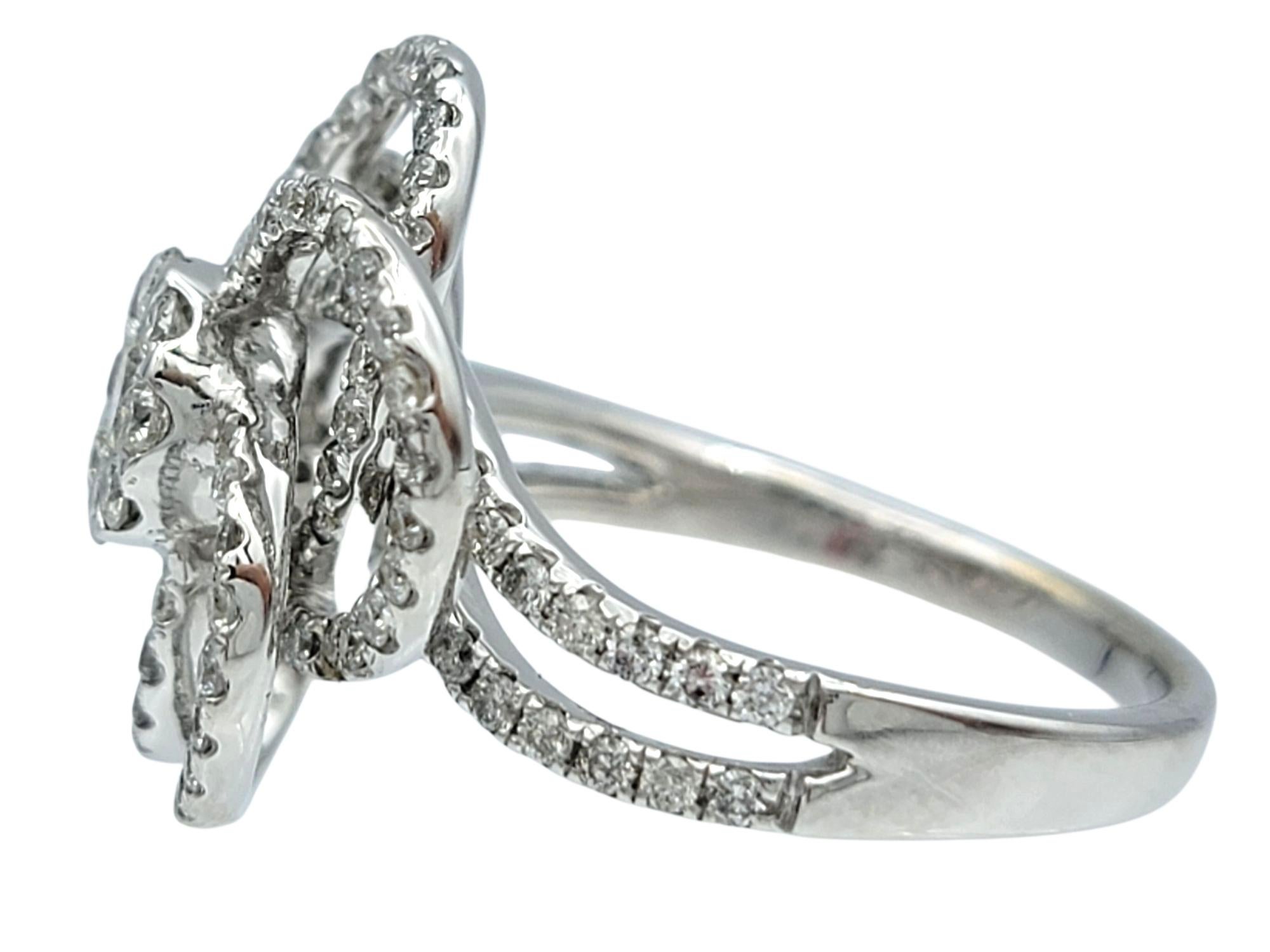 Women's Round Diamond Pavé Flower Motif Cocktail Ring in Polished 14 Karat White Gold For Sale