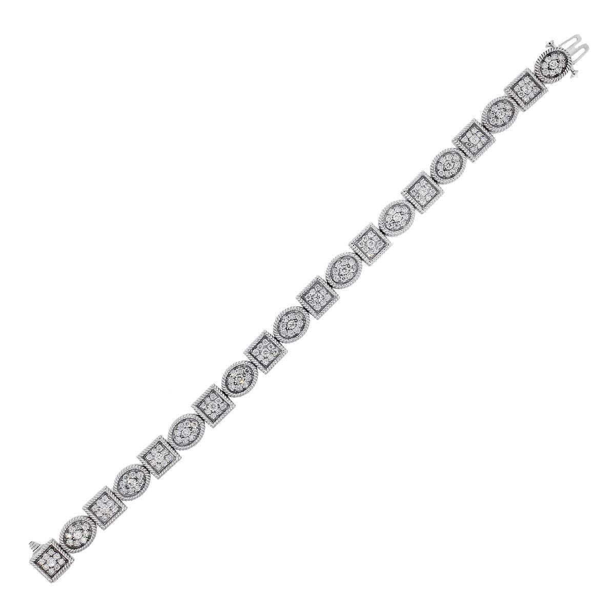 Material: 14k white gold
Diamond Details: Approximately 3.6ctw of round brilliant diamonds. Diamonds are G/H in color and SI in clarity.
Fastening: Tongue in box with double safety latch
Measurements: Will fit a 7.5″ wrist
Item Weight: 28.4g