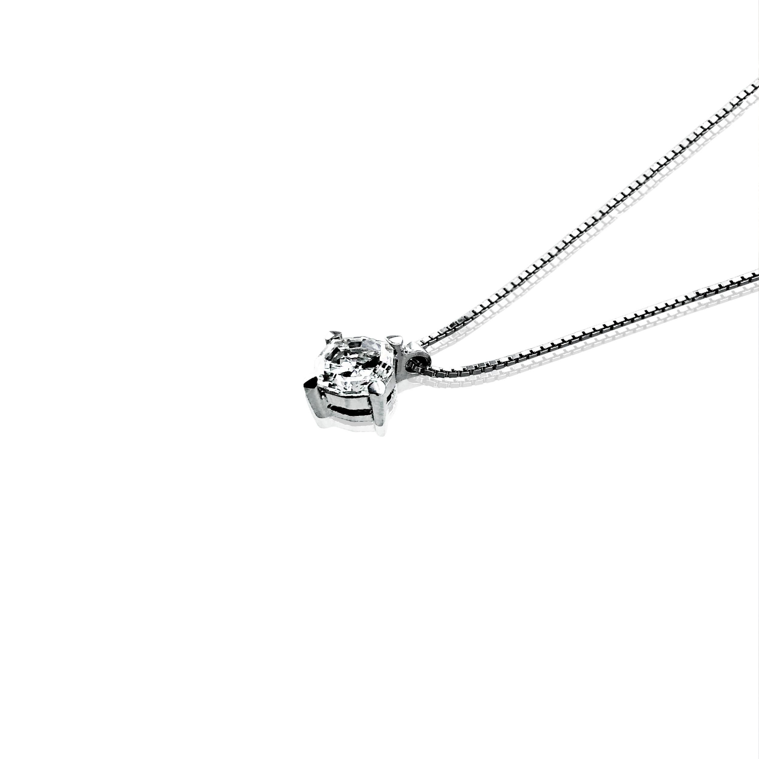 This 0.63 Carat round Diamond pendant necklace is simple, timelessly elegant and wearable all day every day with any outfit. 

Set in an 18Kt white Gold chain with a lobster claw closure, it hangs down the neckline at 20 cm.

A must have in